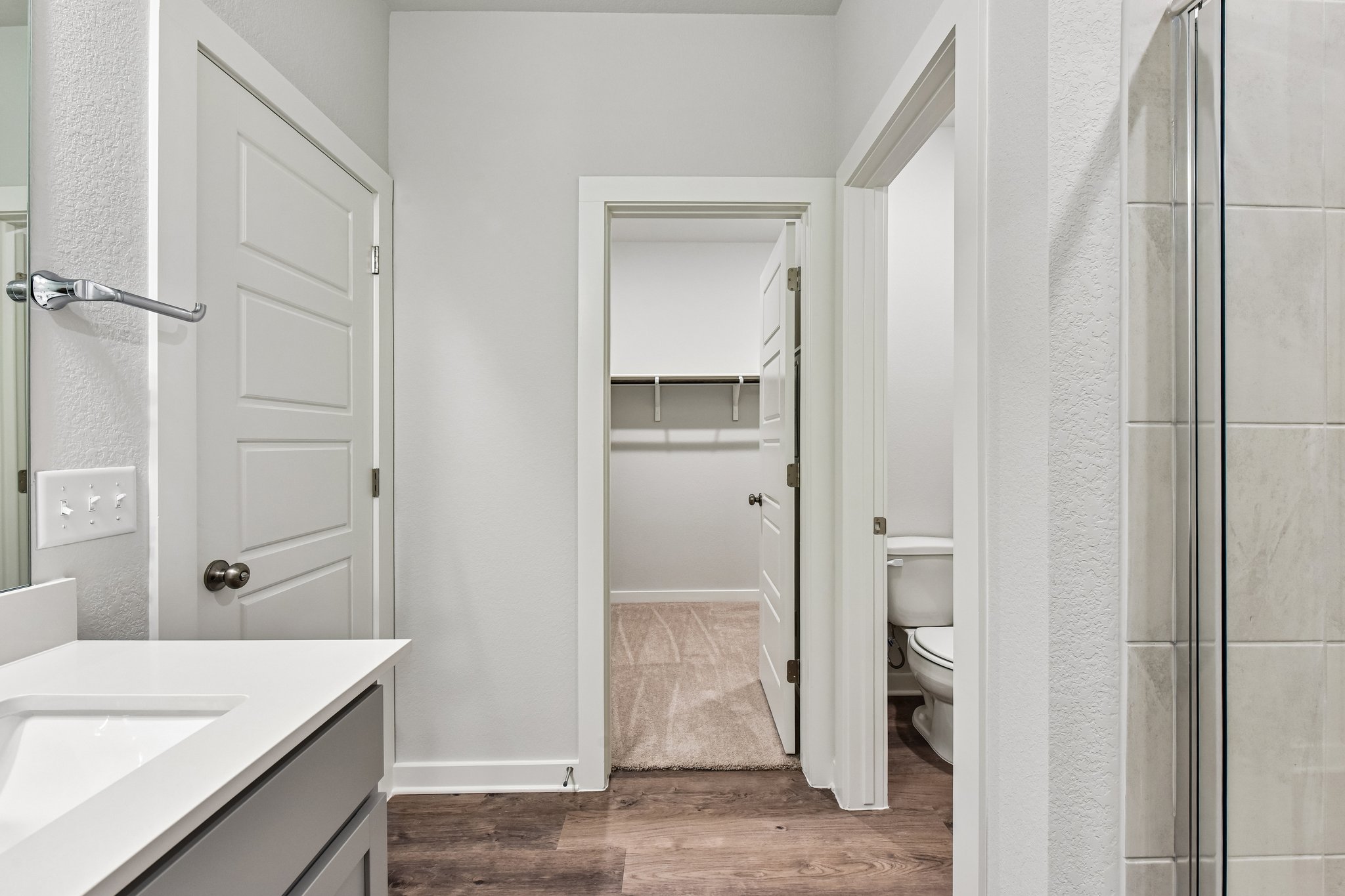 A bathroom with a glass shower.