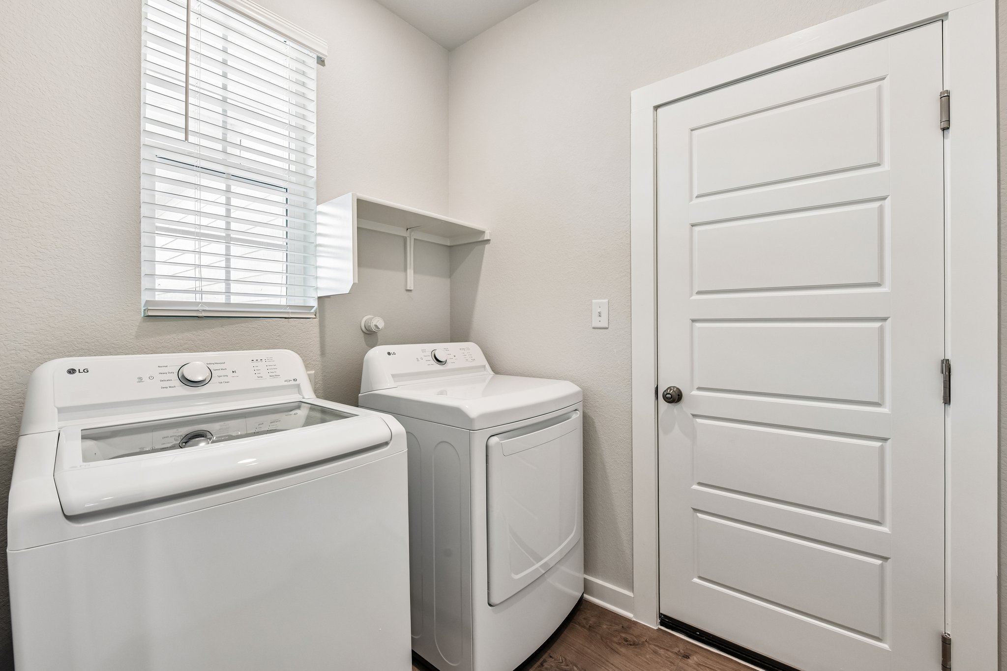 A laundry room with a washer and dryer.