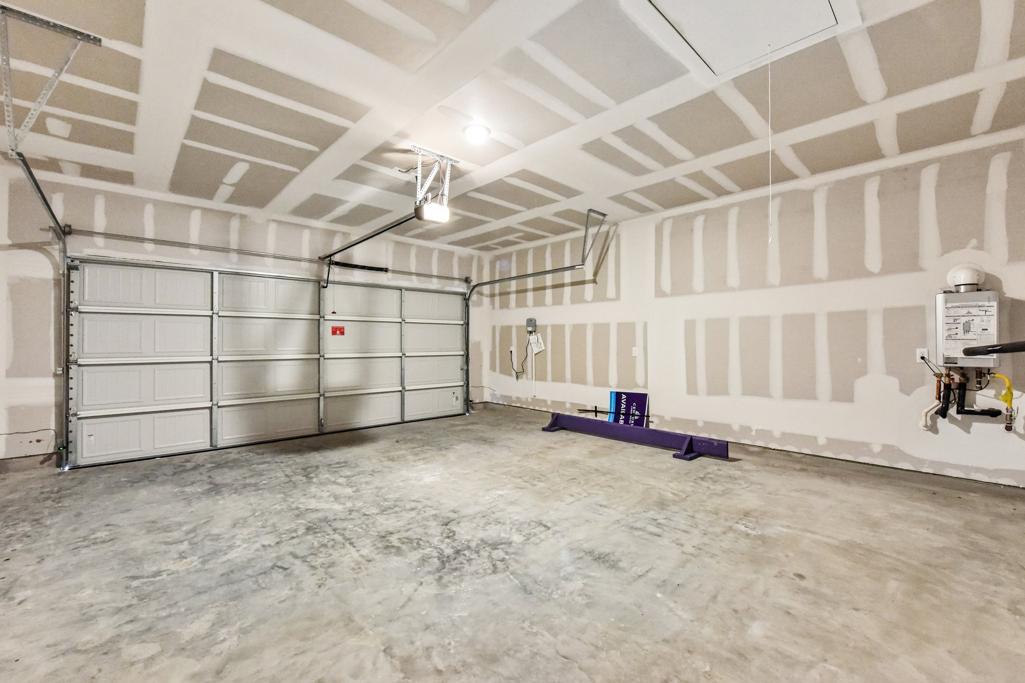 A large empty room with a few machines.