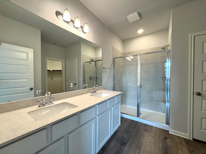 A bathroom with a glass shower.