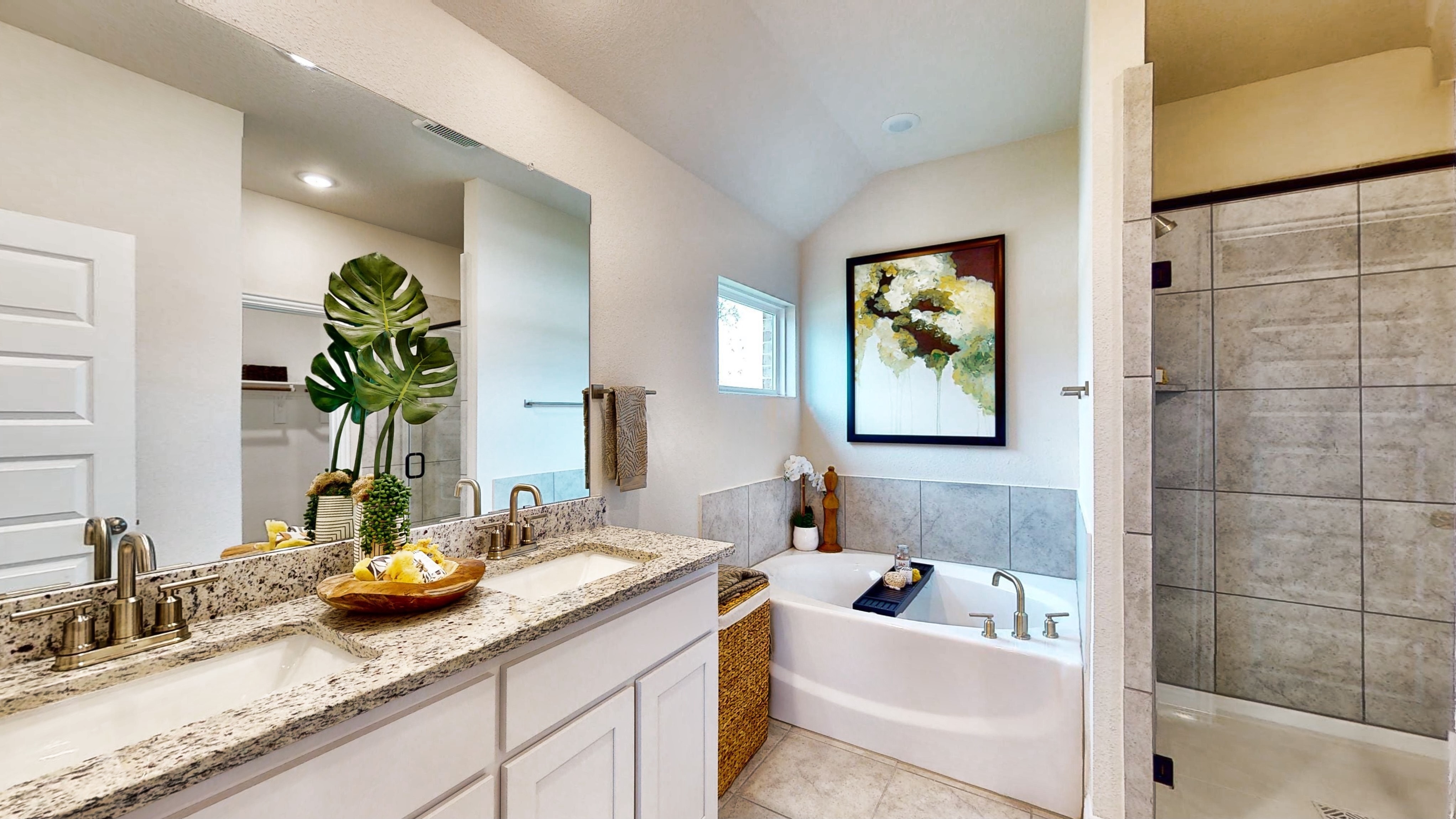 A bathroom with a tub sink and a bathtub.
