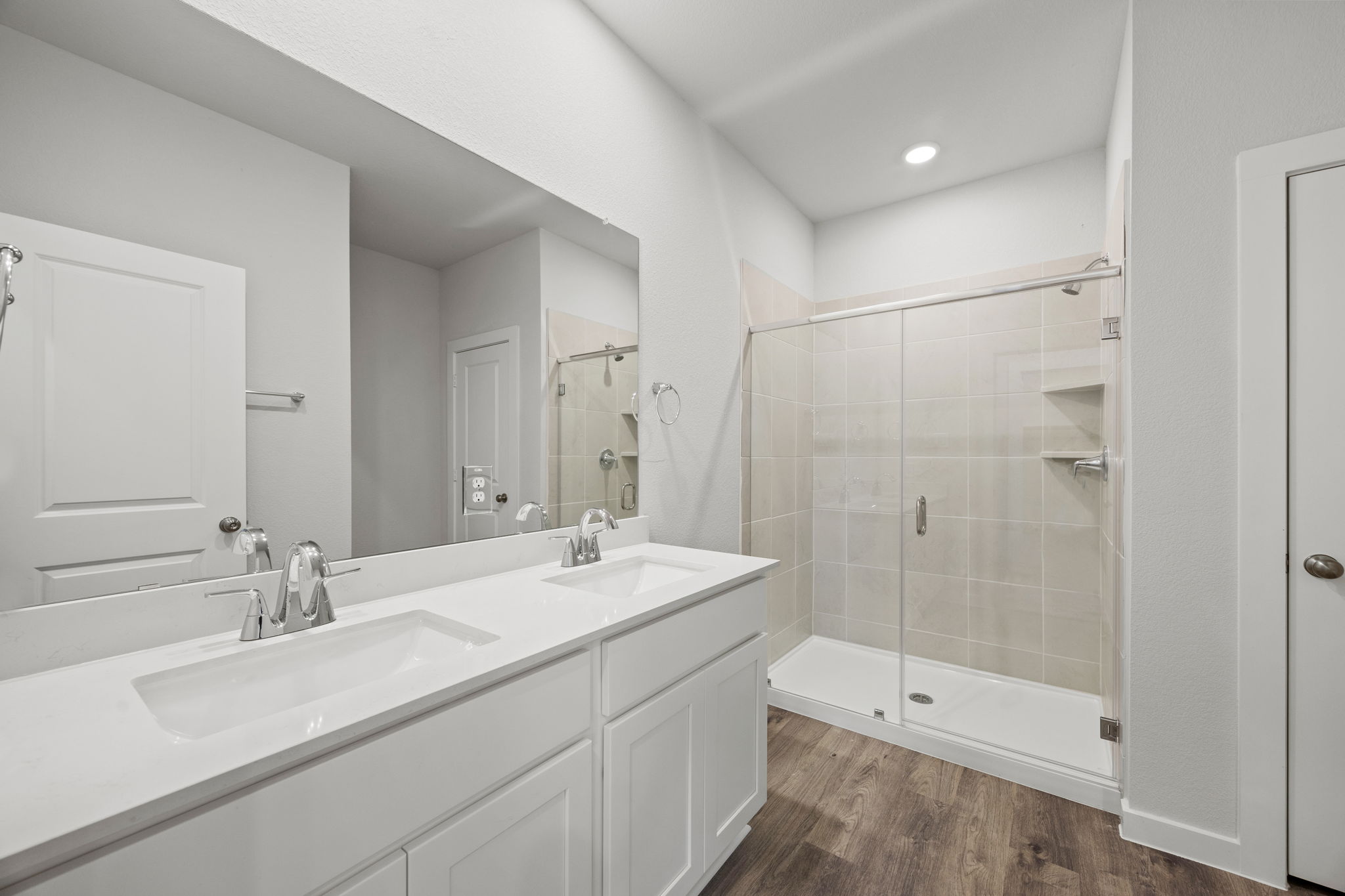 A bathroom with a glass shower.