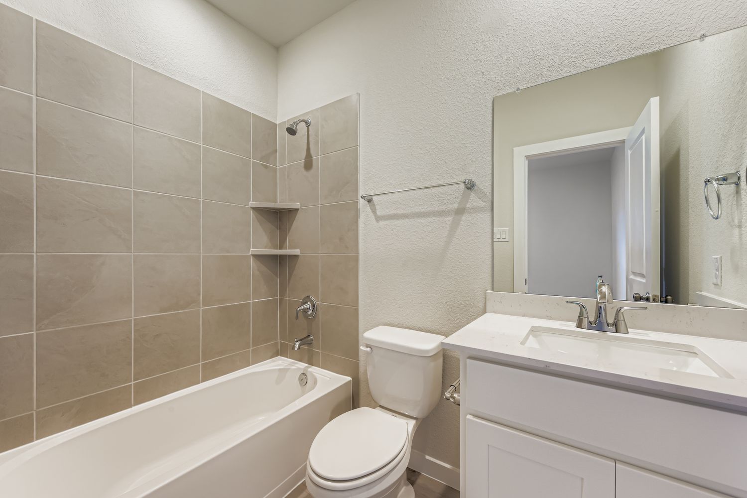 A bathroom with a toilet and sink.