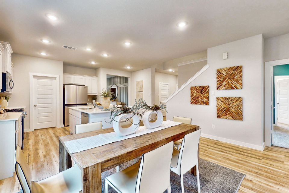 A kitchen with white walls.