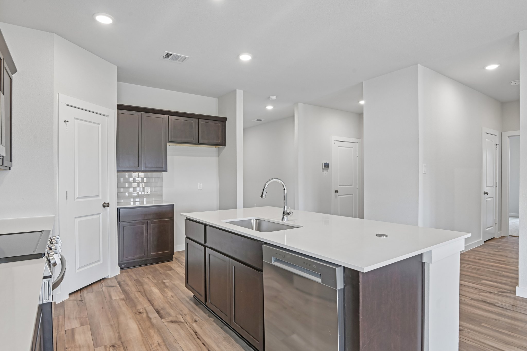 A kitchen with a sink and cabinets.