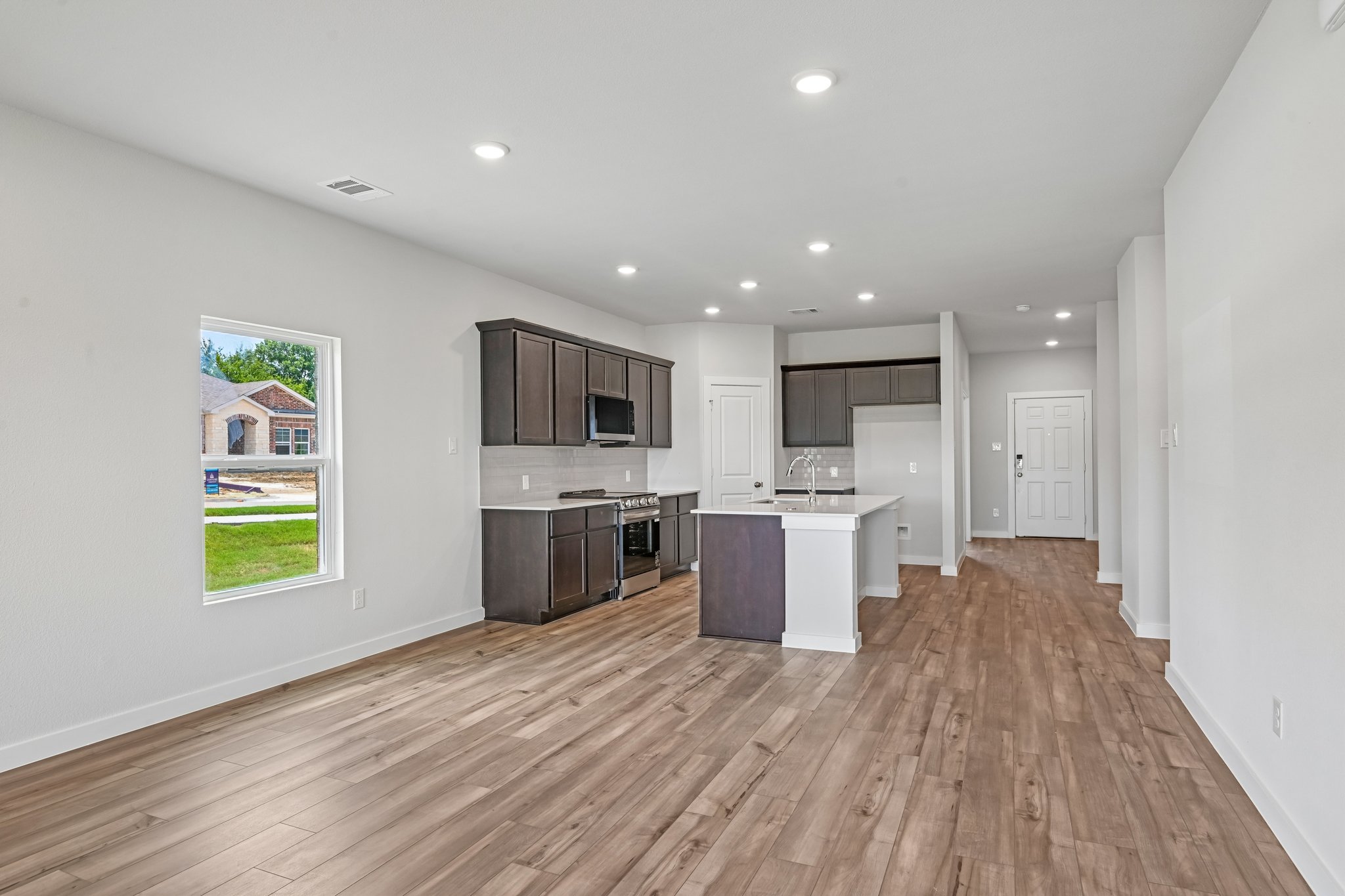 A kitchen with white walls.