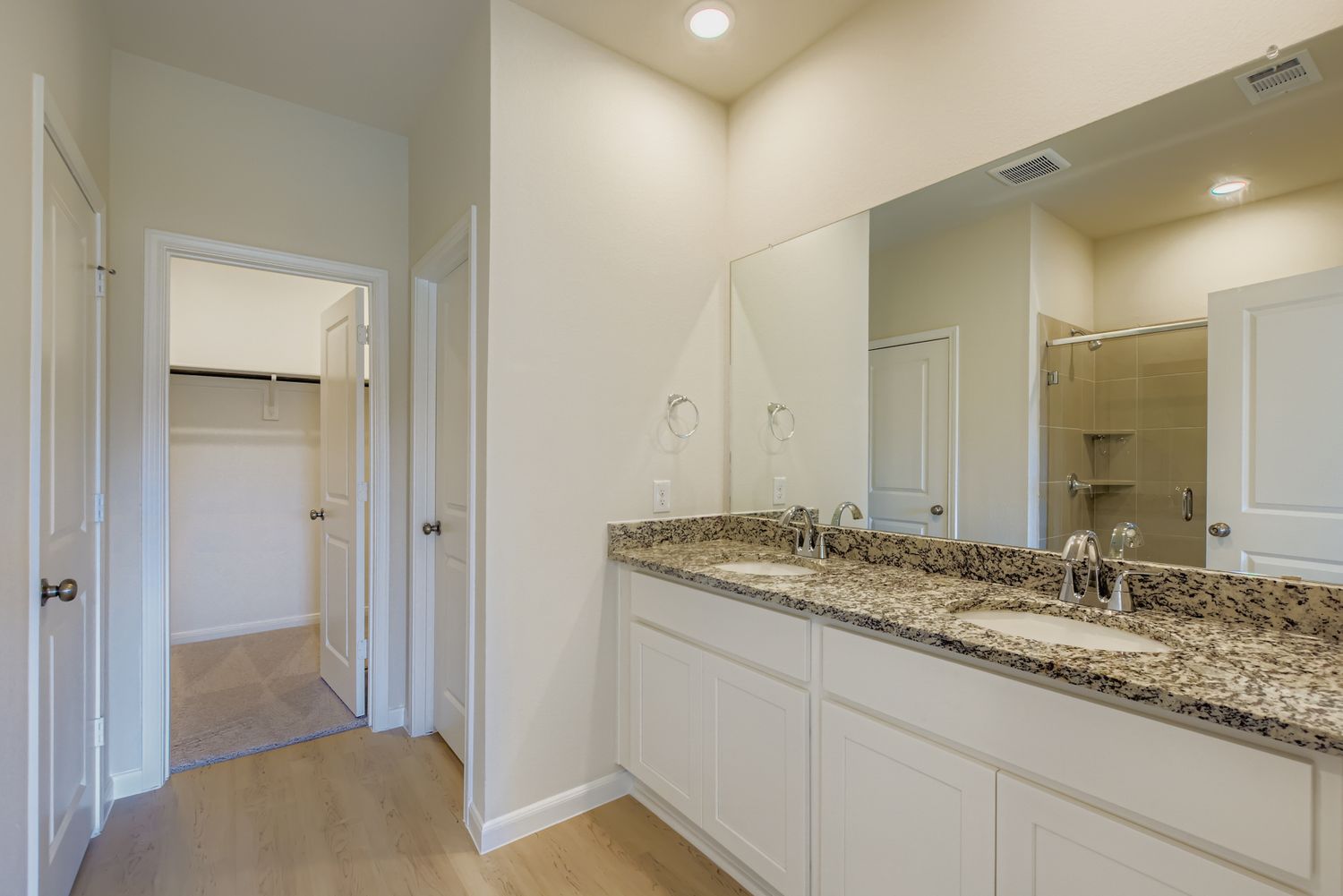 A bathroom with a marble countertop.
