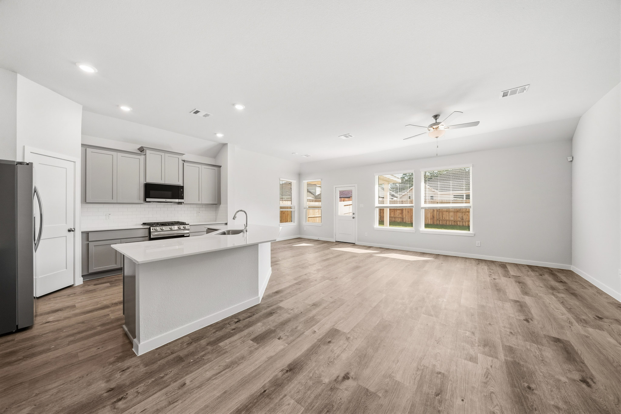 A large kitchen with white cabinets.