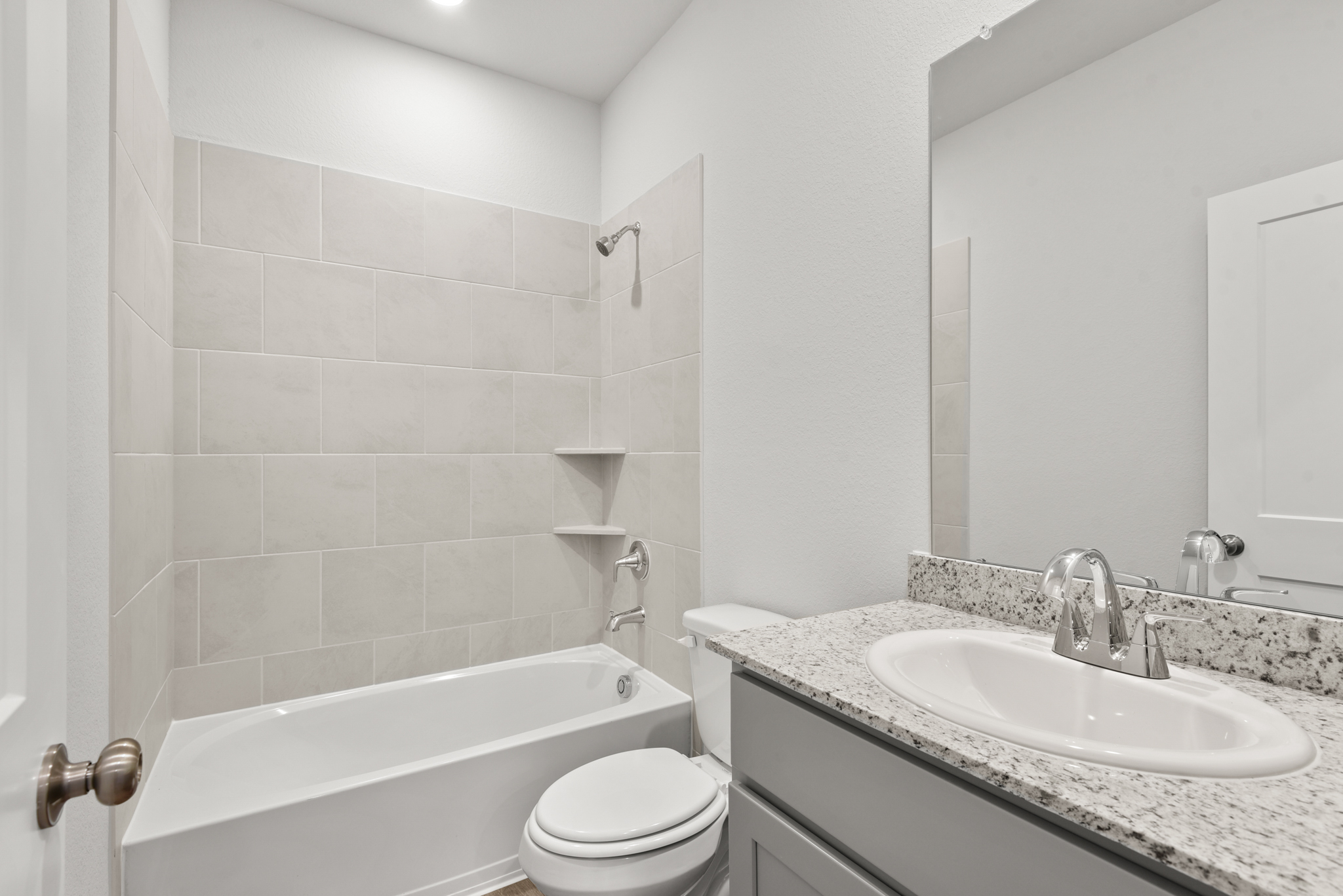 A bathroom with a sink and a toilet.