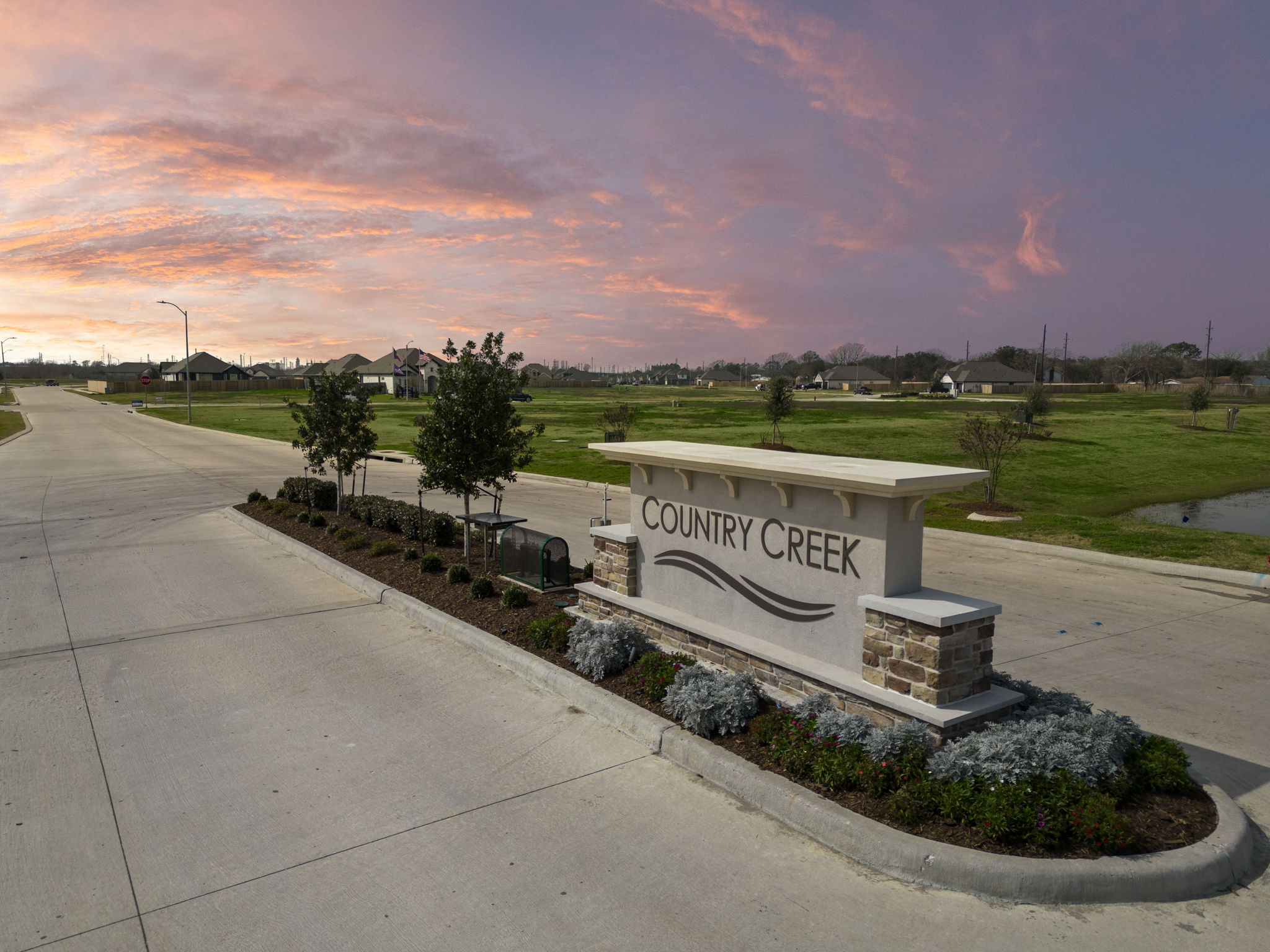 A stone memorial with a sign.