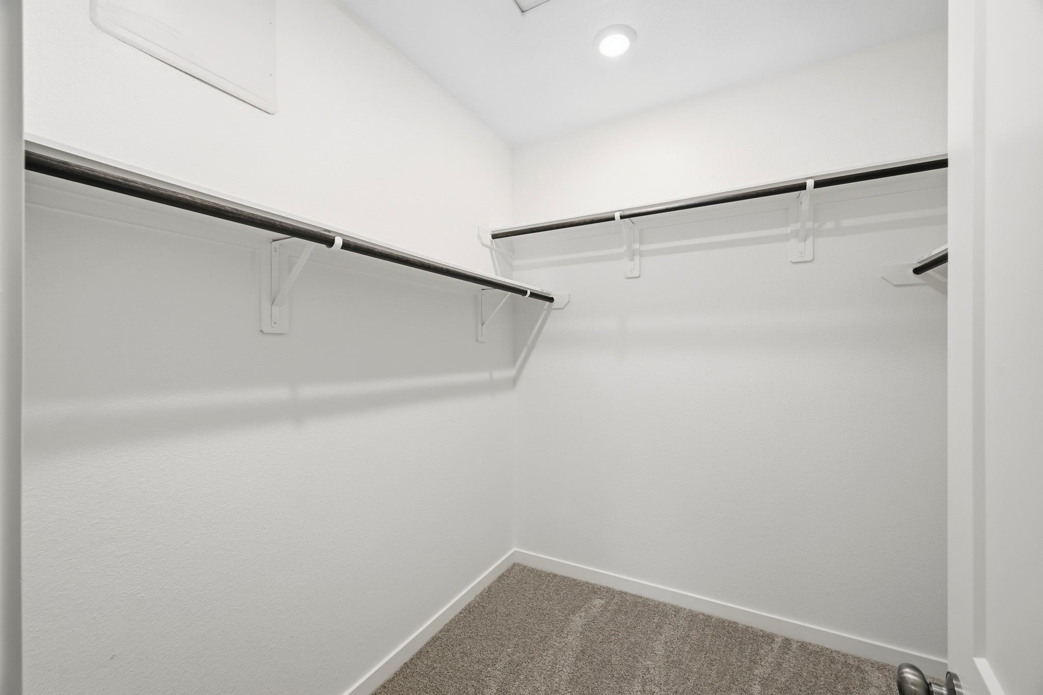 A white wall with a light.