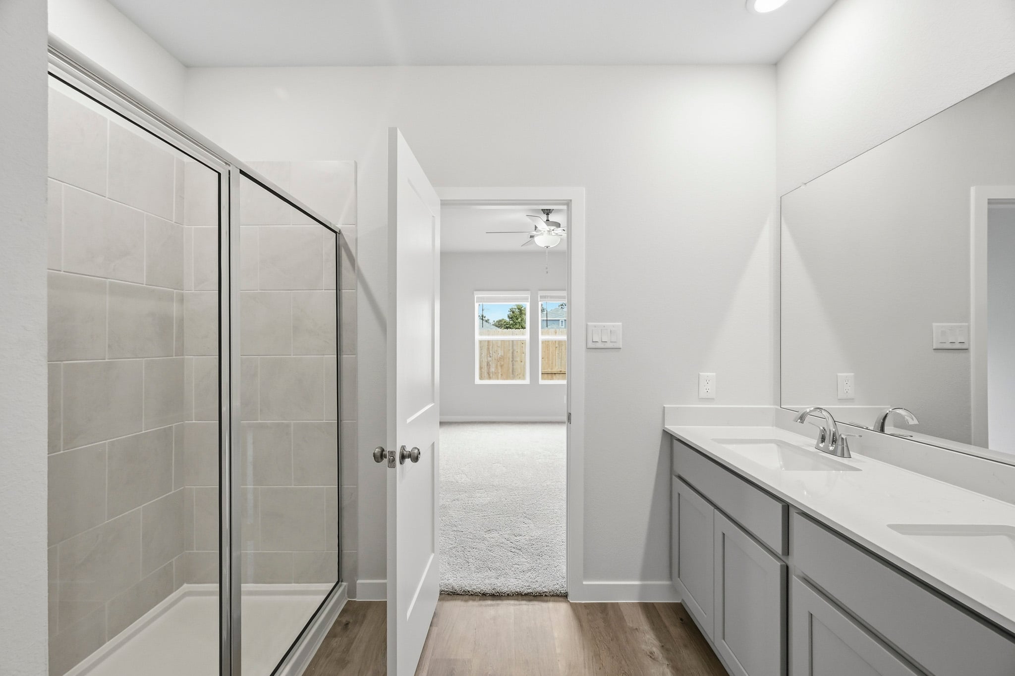 A bathroom with a glass shower.