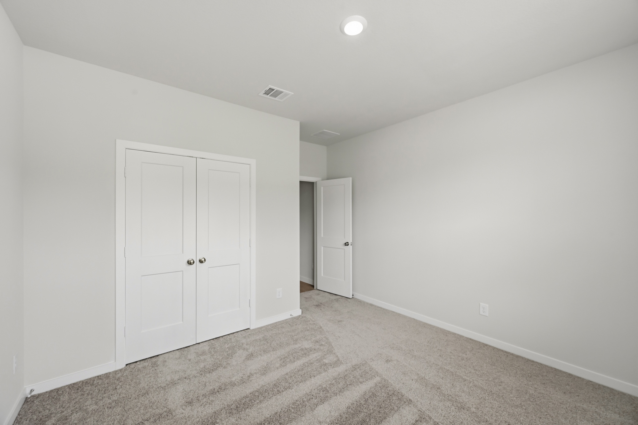 A room with white doors.