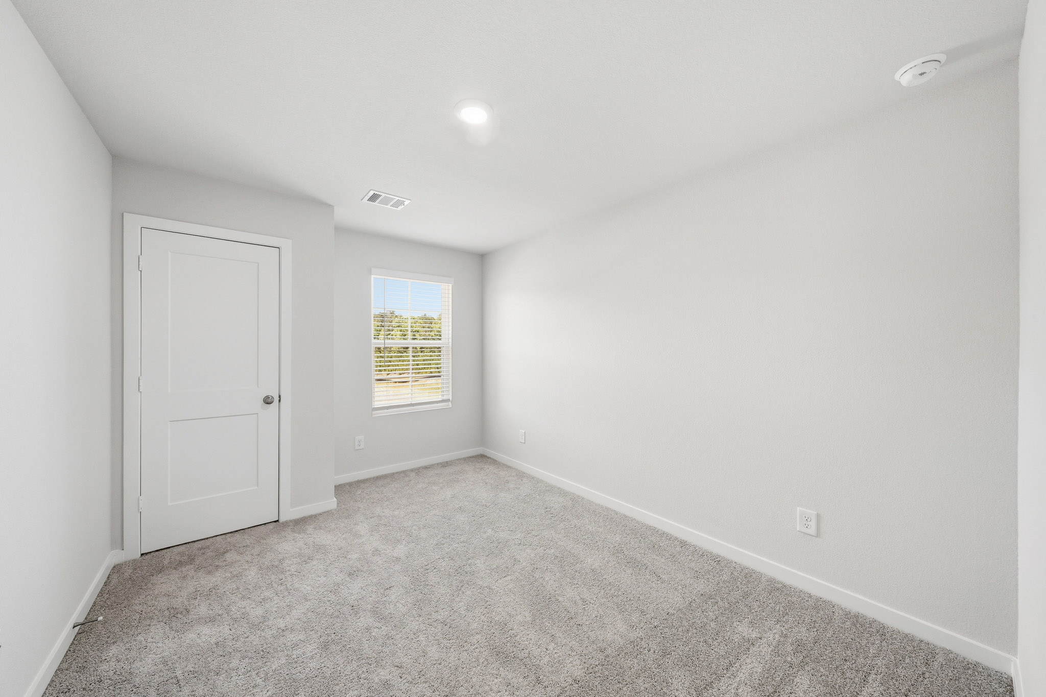 A room with a door and a window.