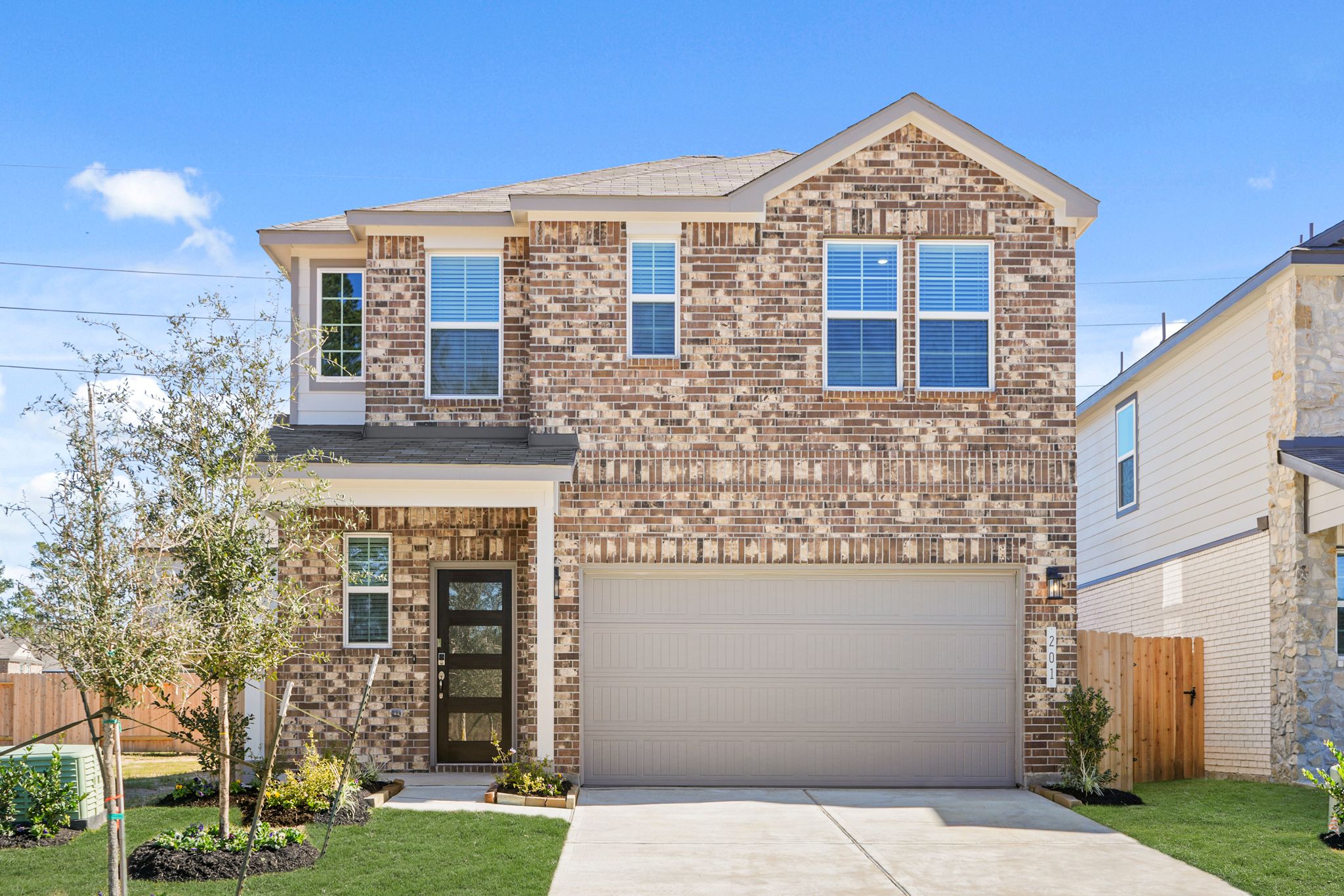 A brick building with a garage.