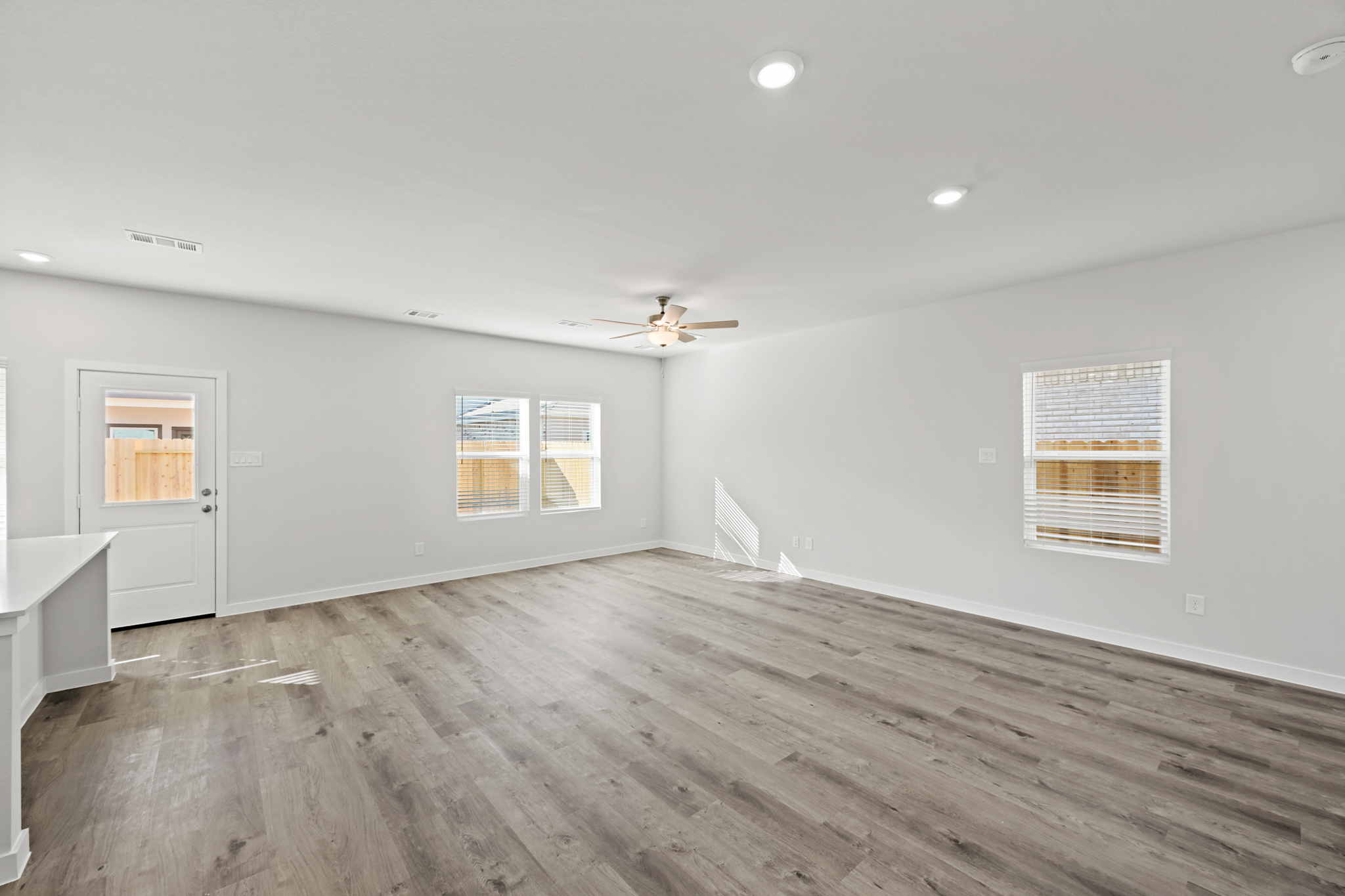 A room with a wood floor and a wood floor with a wood floor.