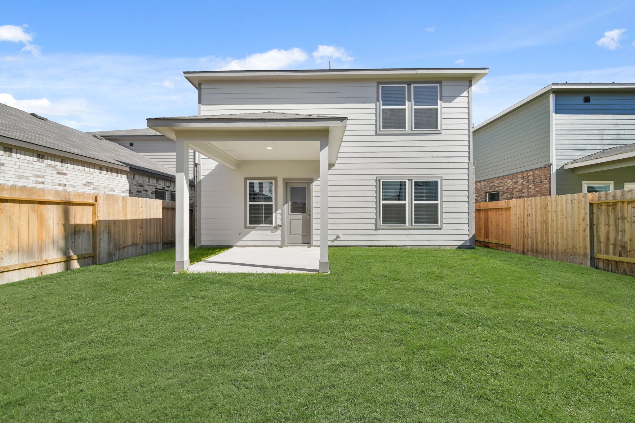A house with a fence around it.