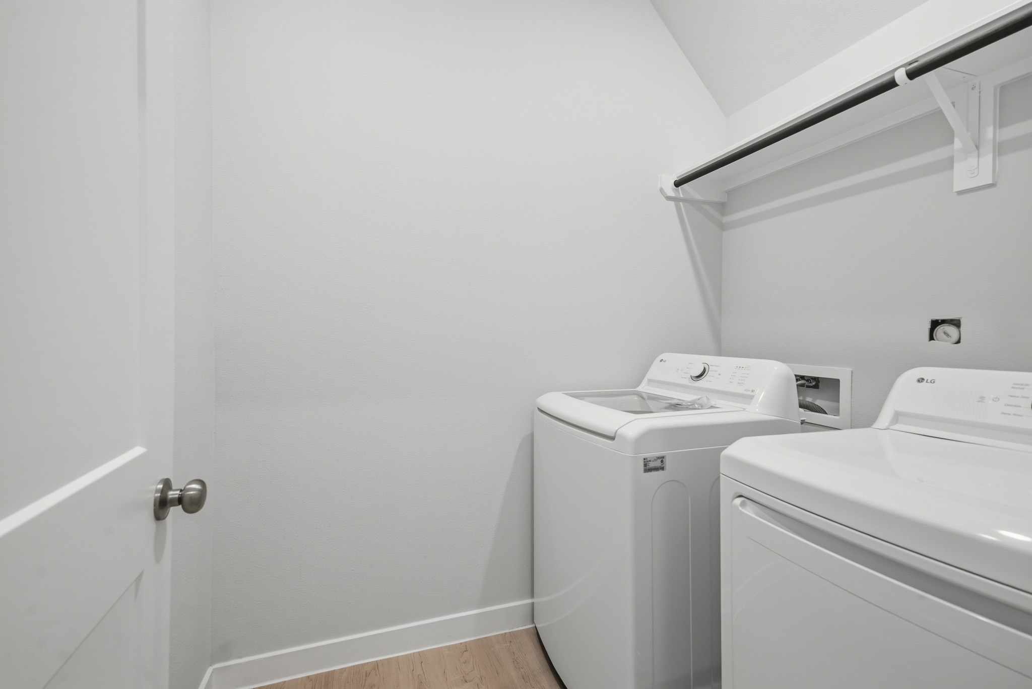 A washing machine in a room.