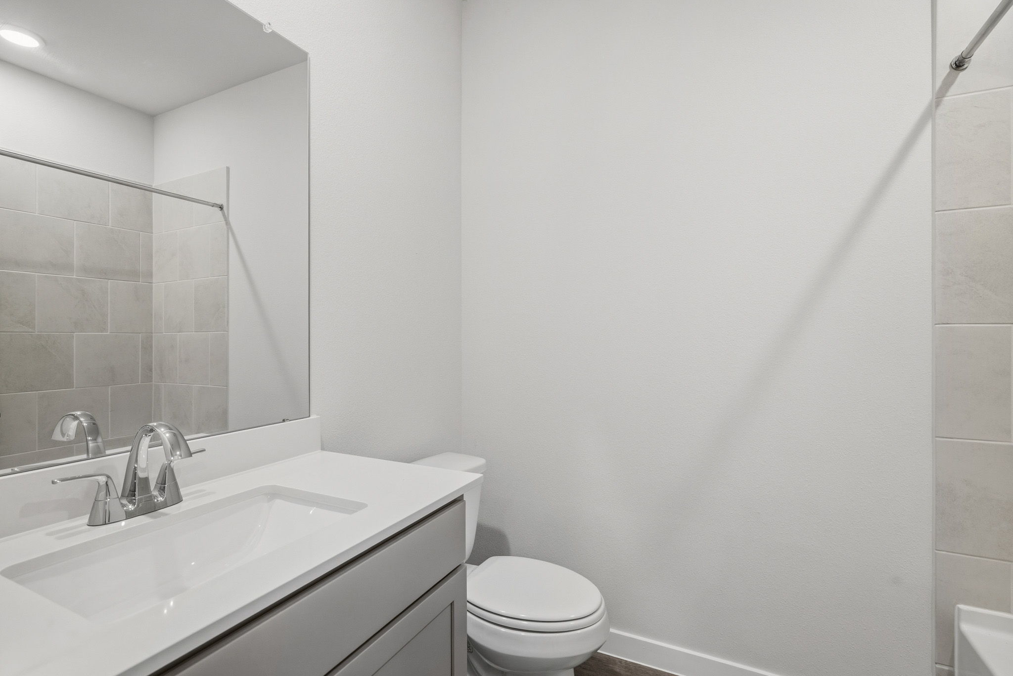A bathroom with a sink and toilet.