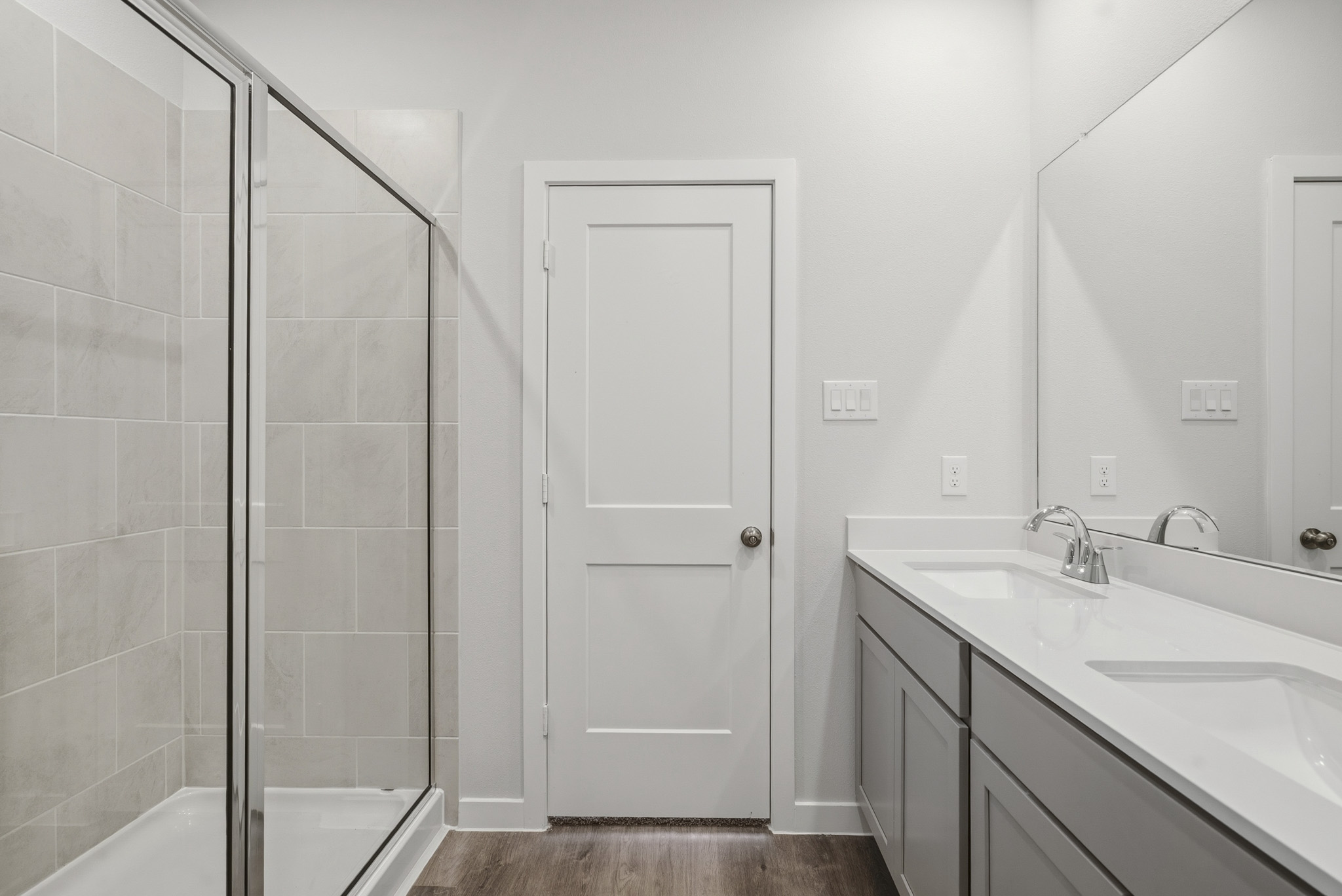 A bathroom with a glass shower.