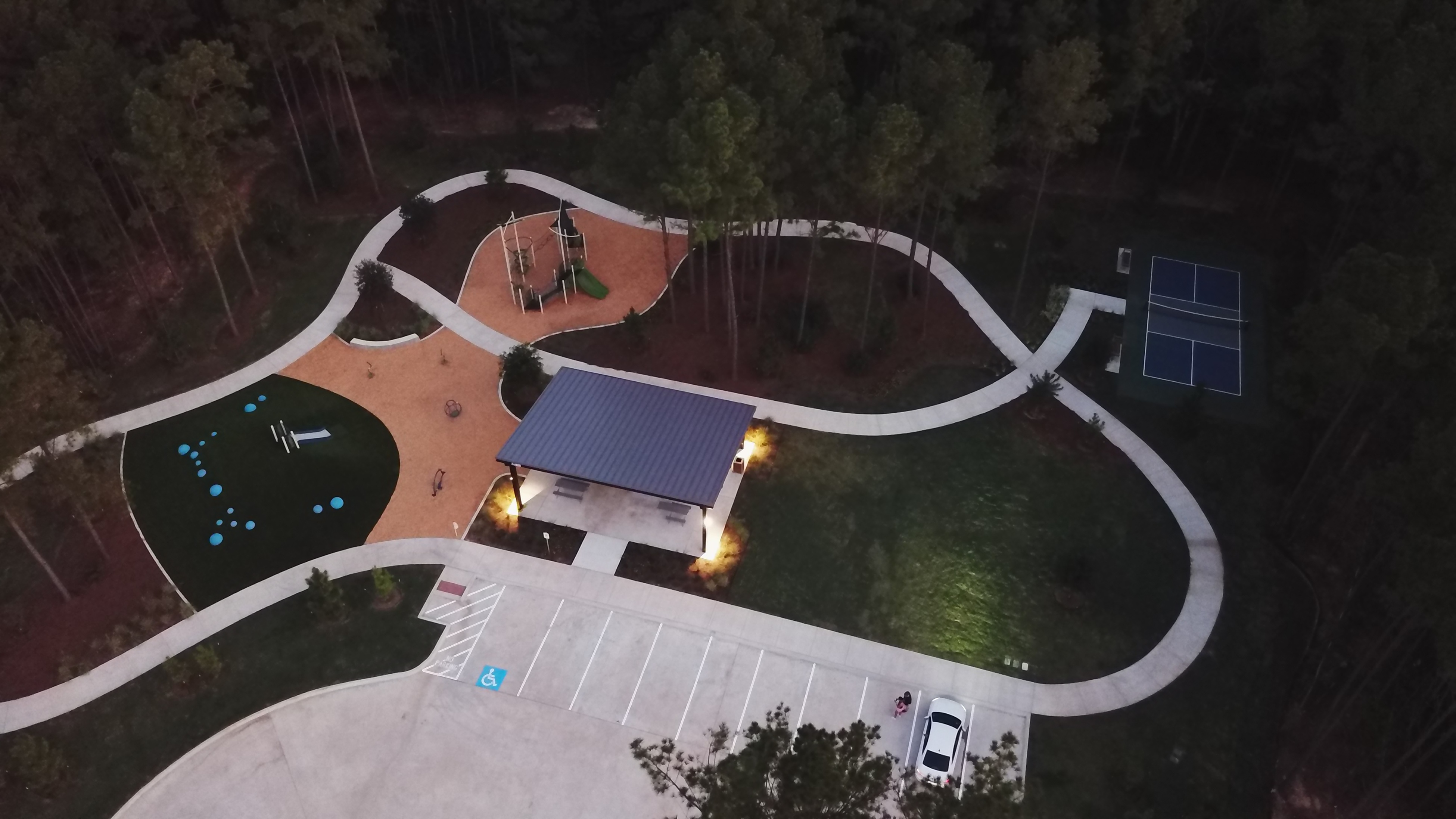 A building with a pool and a large circular pool.