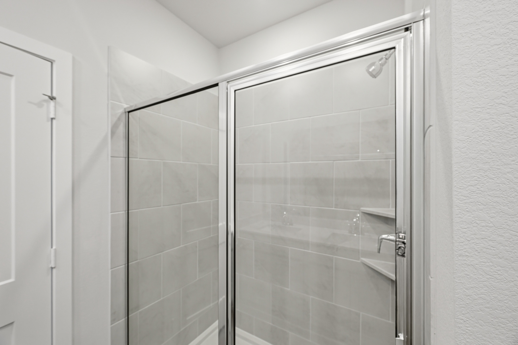 A shower unit in a bathroom.