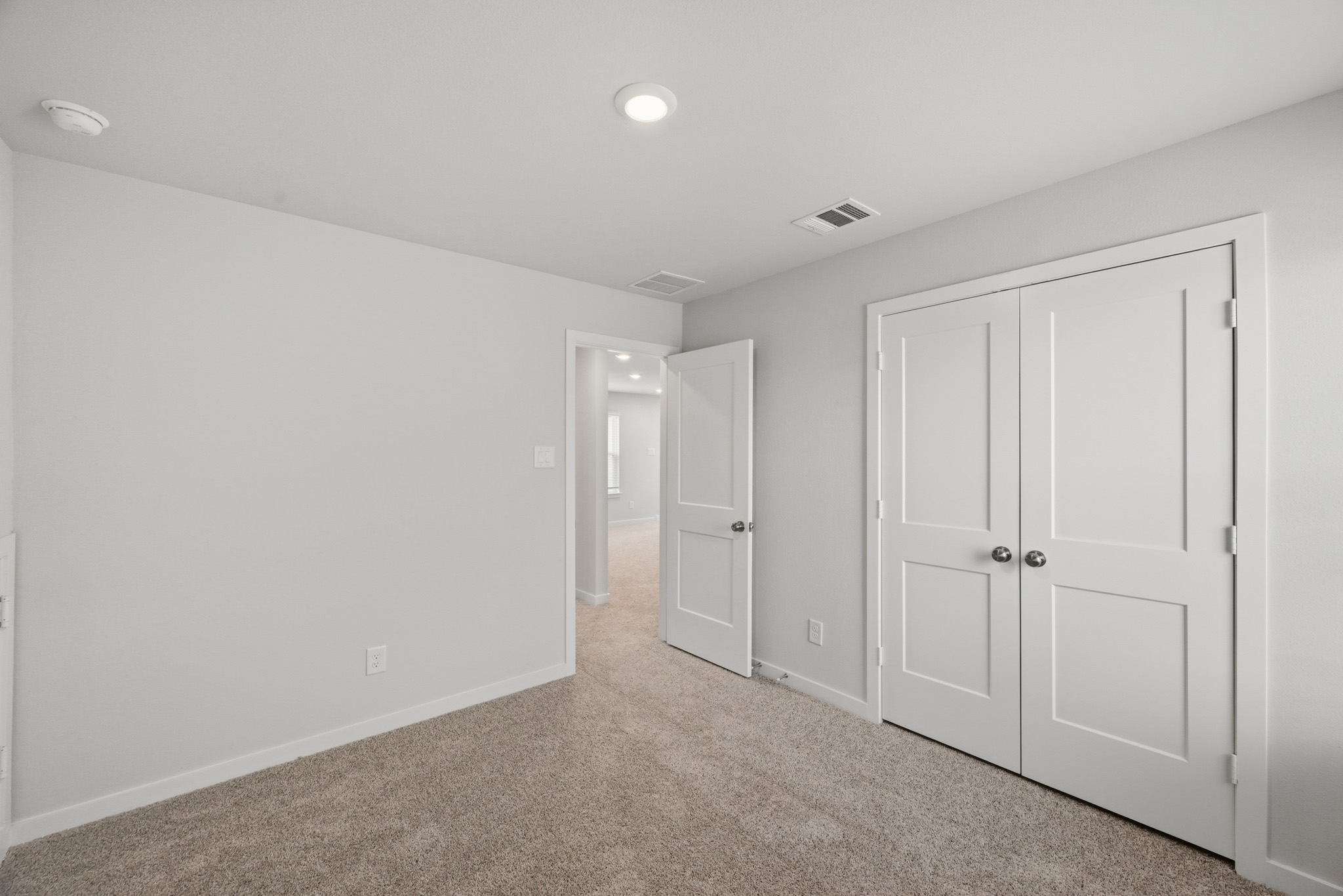 A room with white doors.