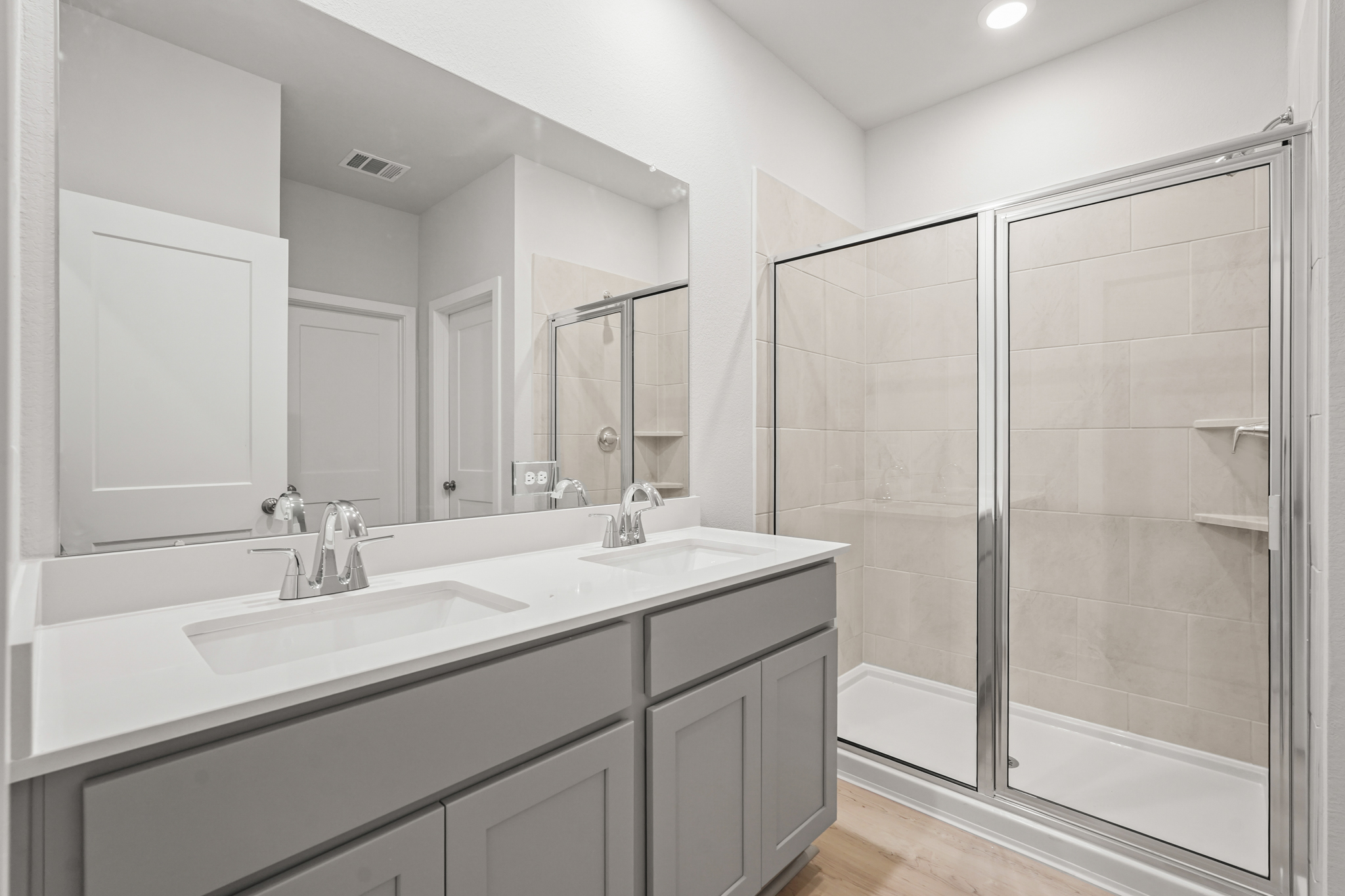 A bathroom with a glass shower.