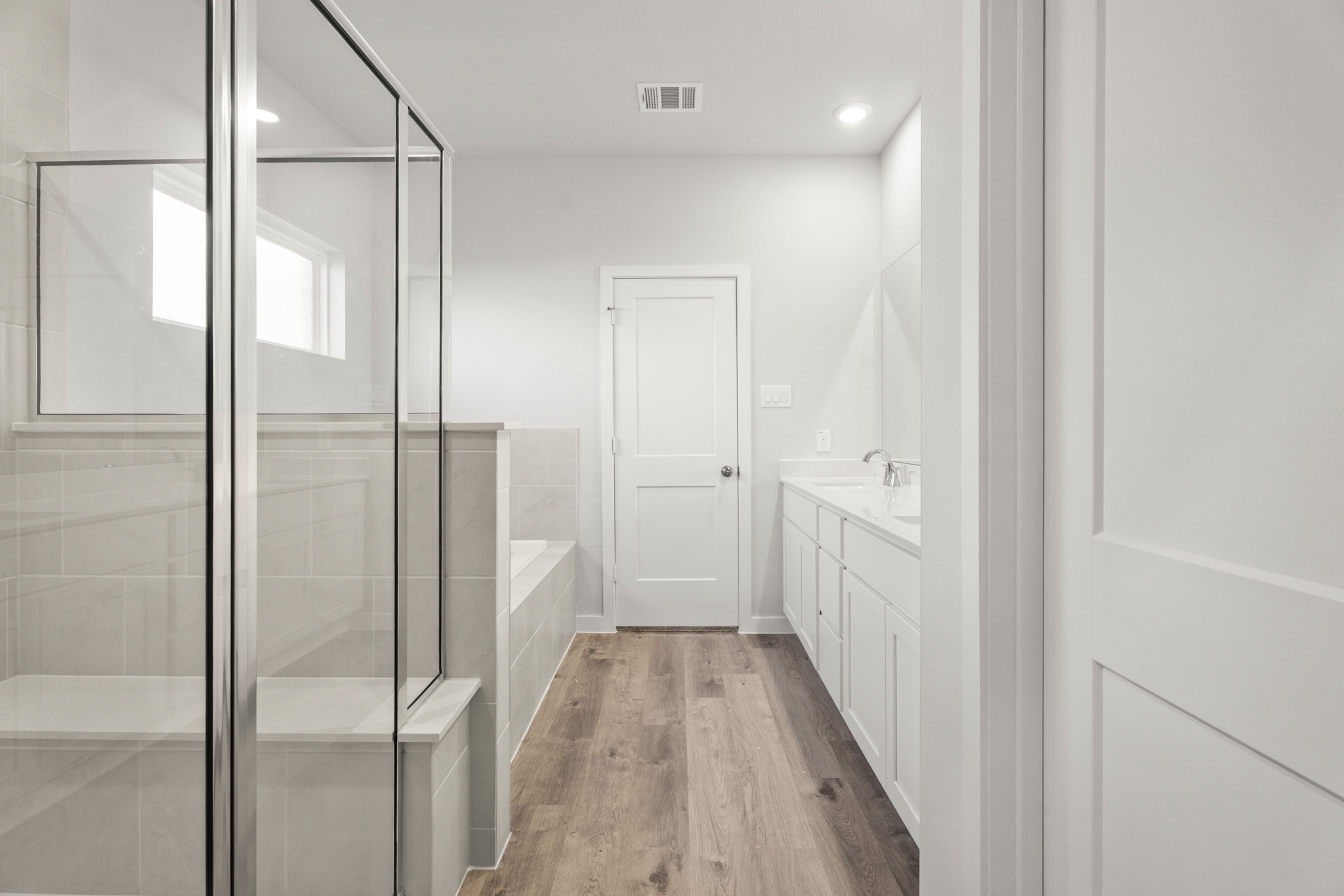 A bathroom with a glass shower.