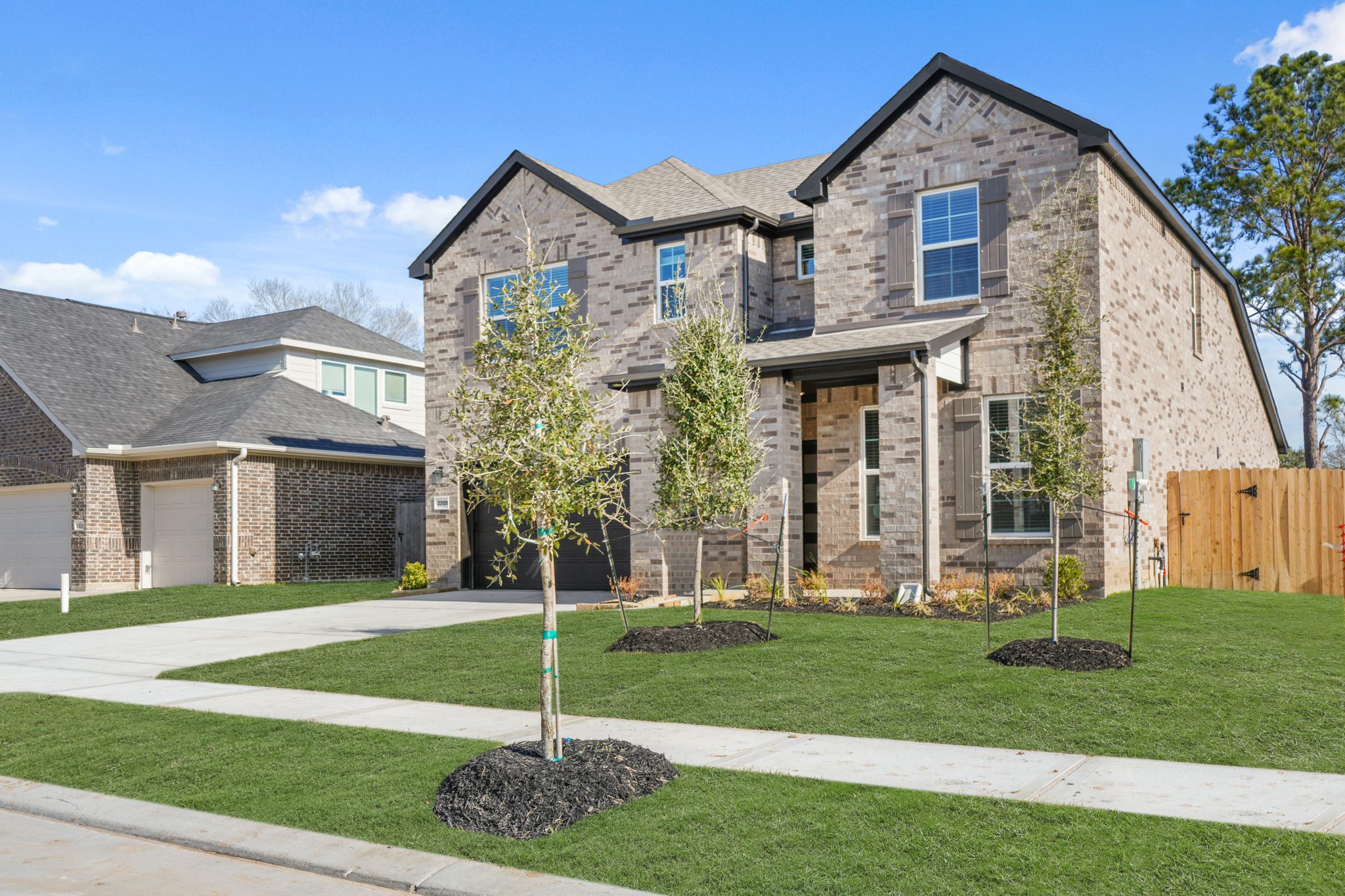 A large house with a lawn.