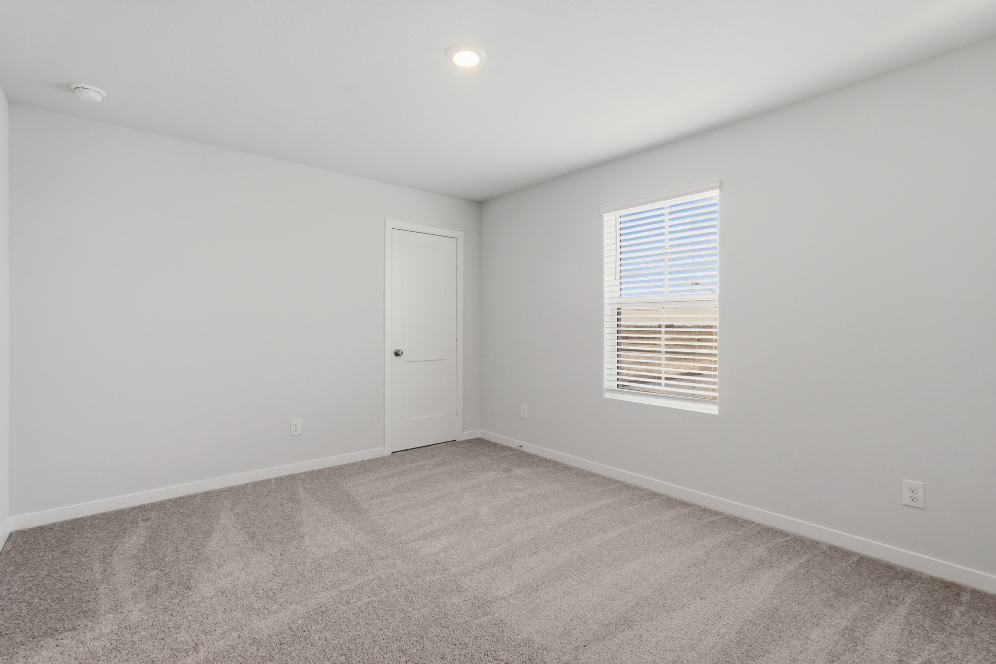 A room with a door and a window.