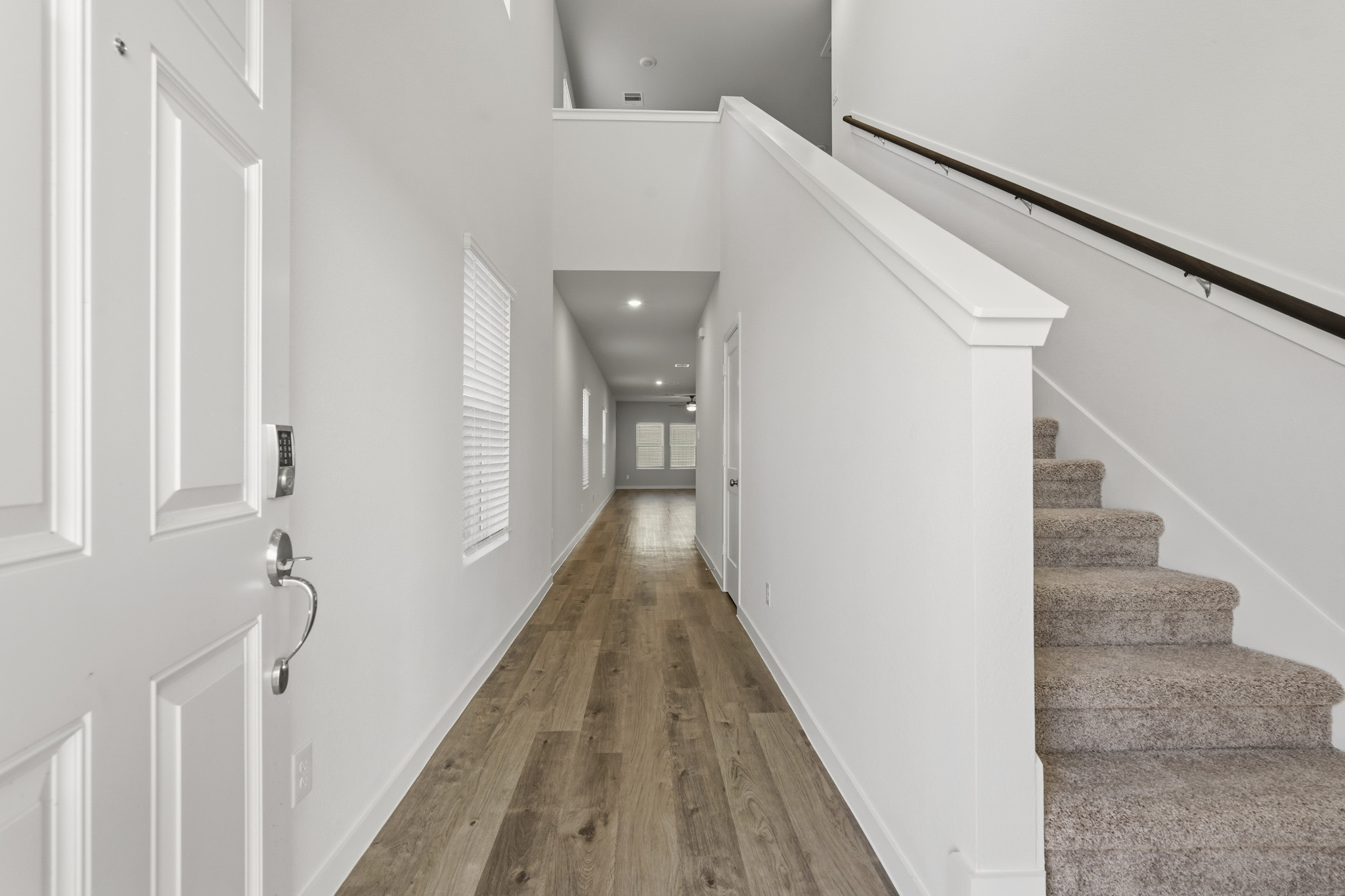 A hallway with white doors.