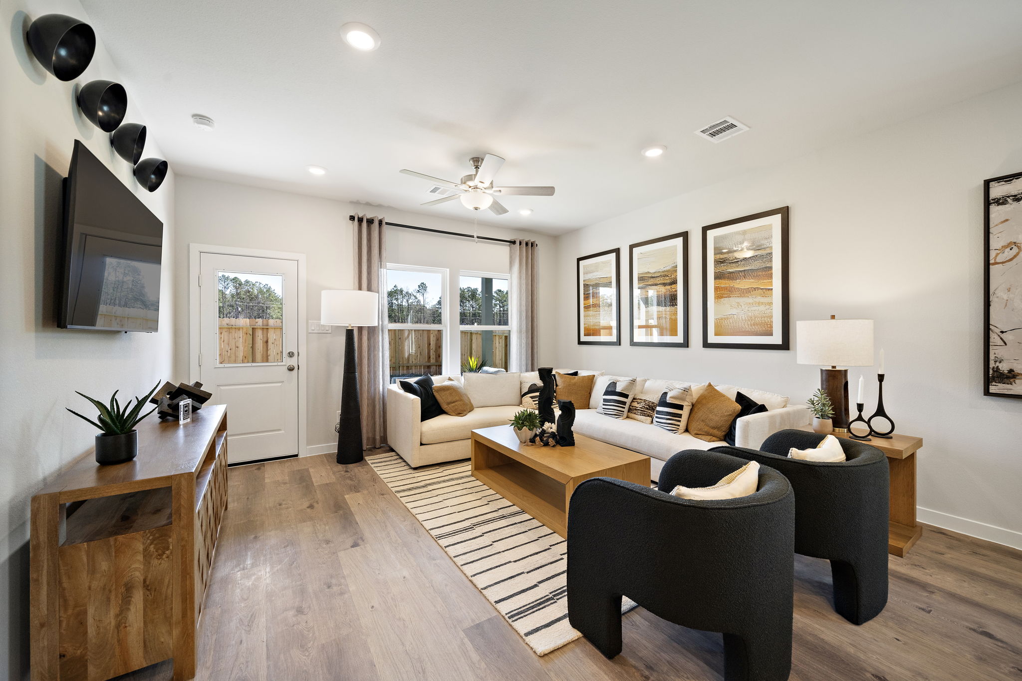A living room with a wood floor.