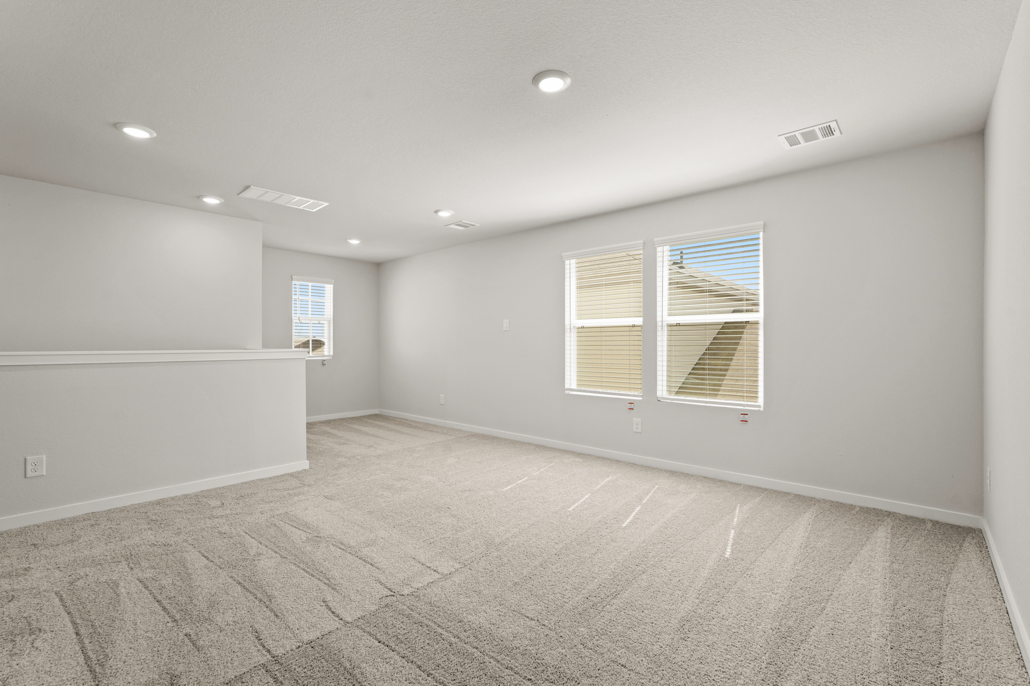 A room with a tile floor and windows.