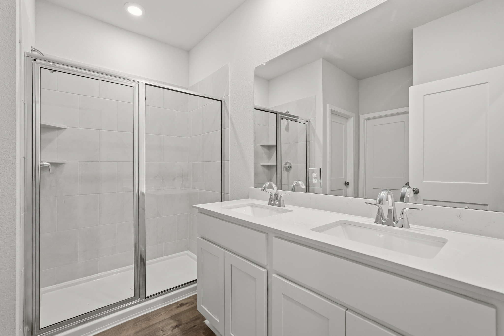 A bathroom with a glass shower.