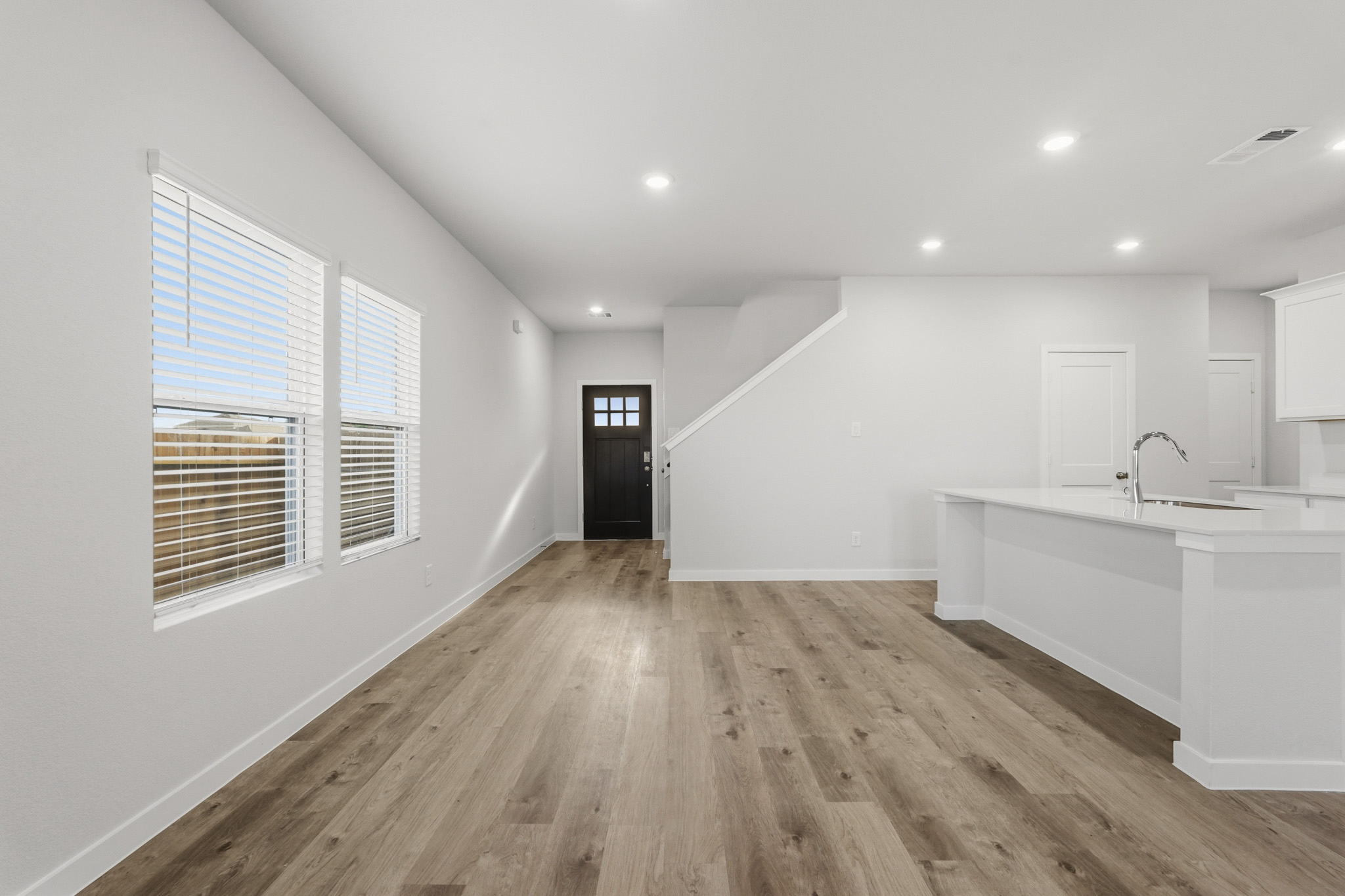 A bathroom with a wood floor.