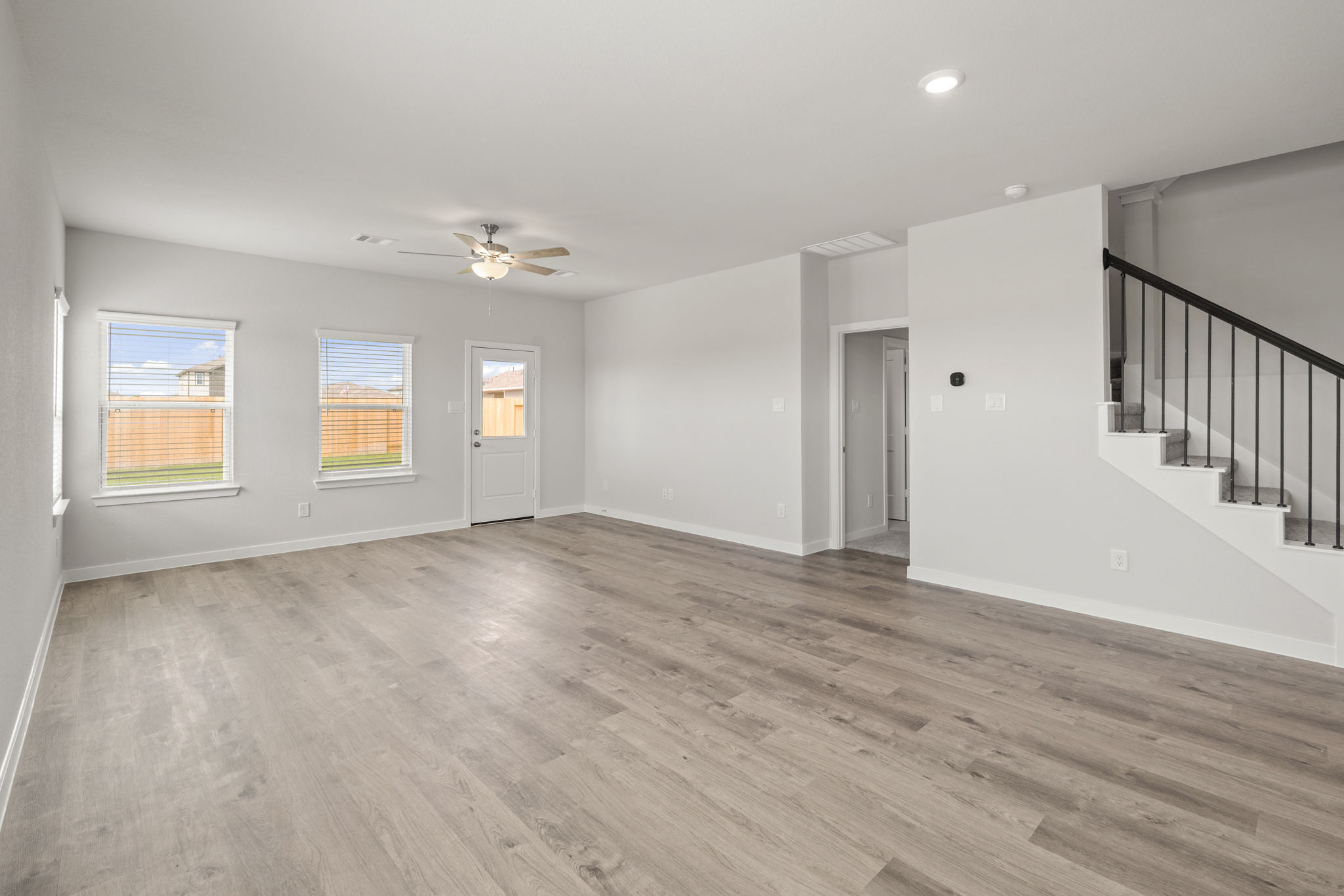 A room with a wood floor and a wood floor.