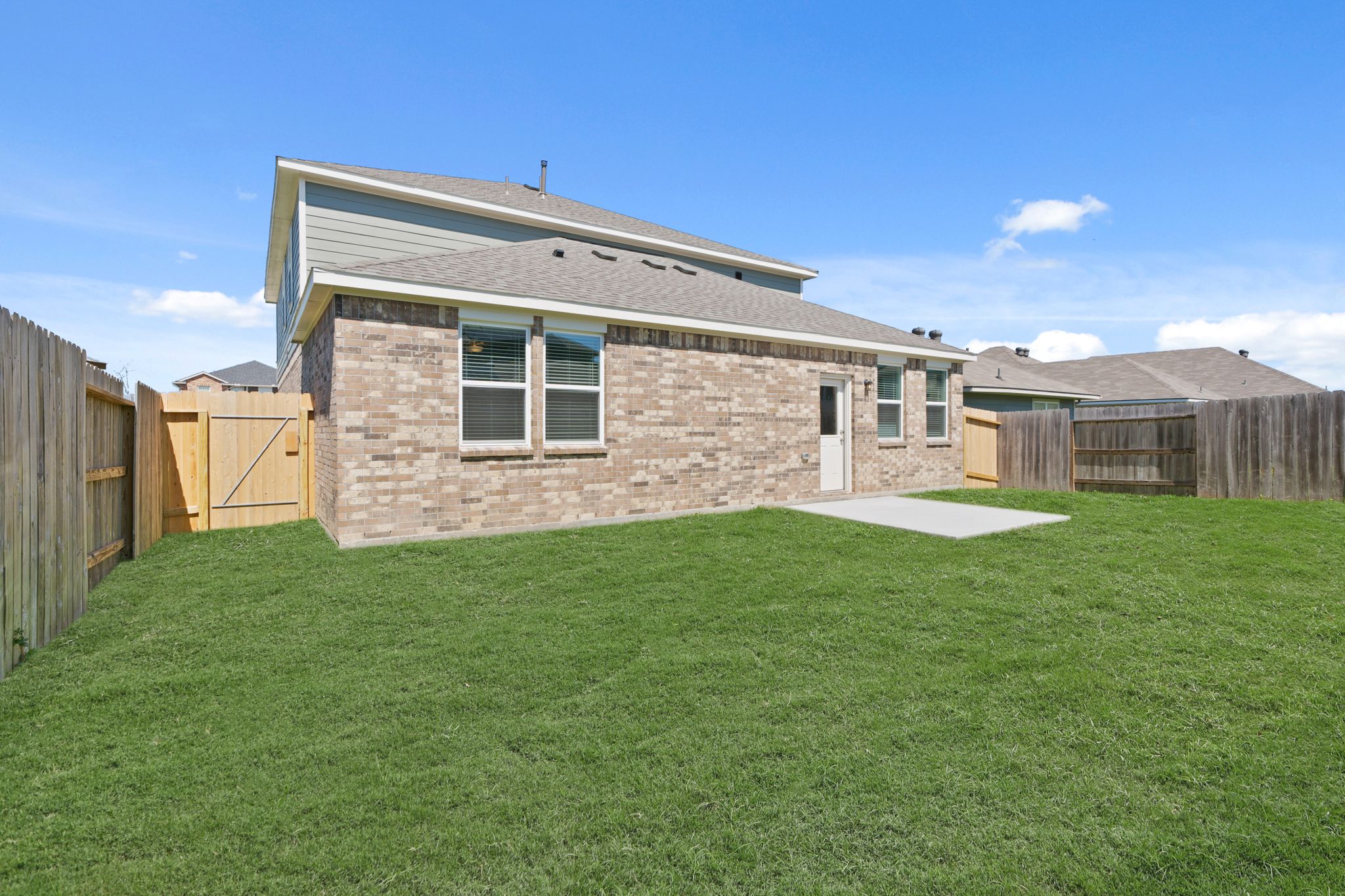 A house with a green lawn.
