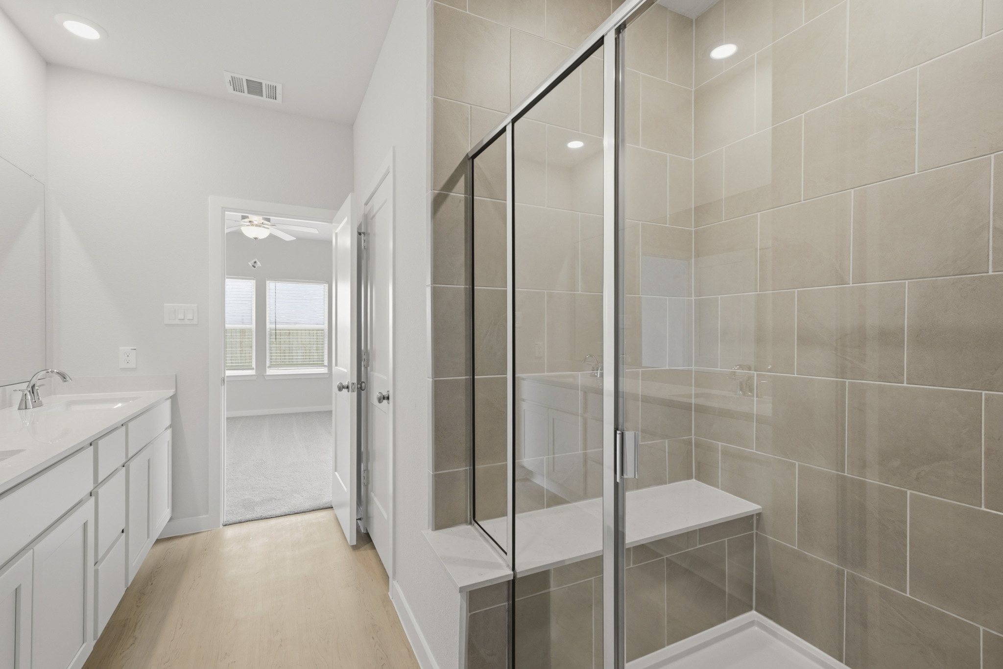 A bathroom with a glass shower.