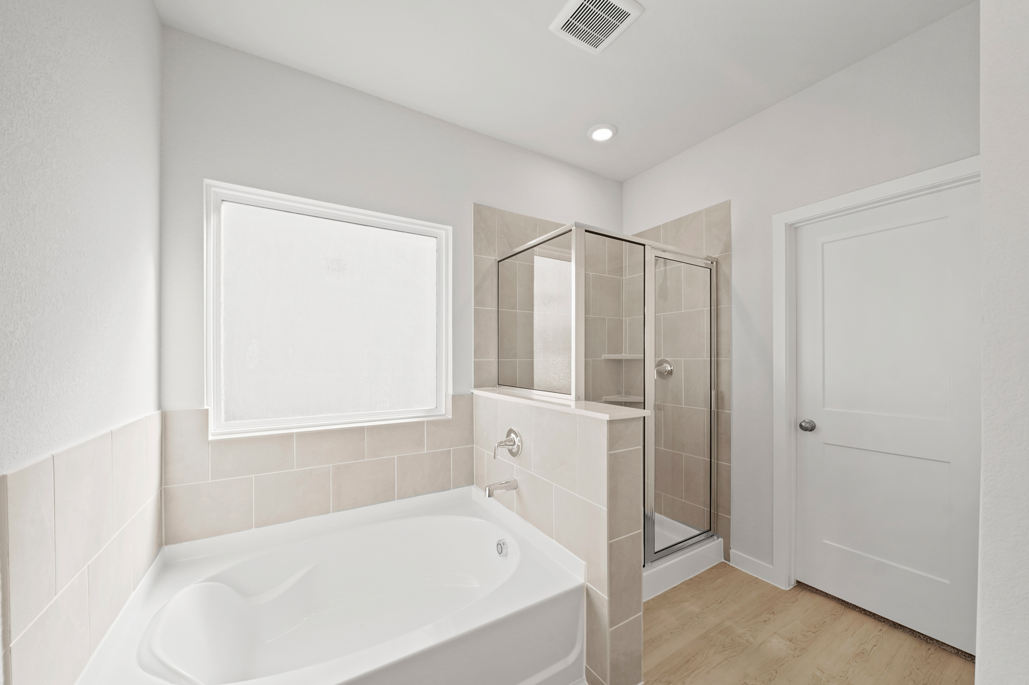 A bathroom with a tub and sink.