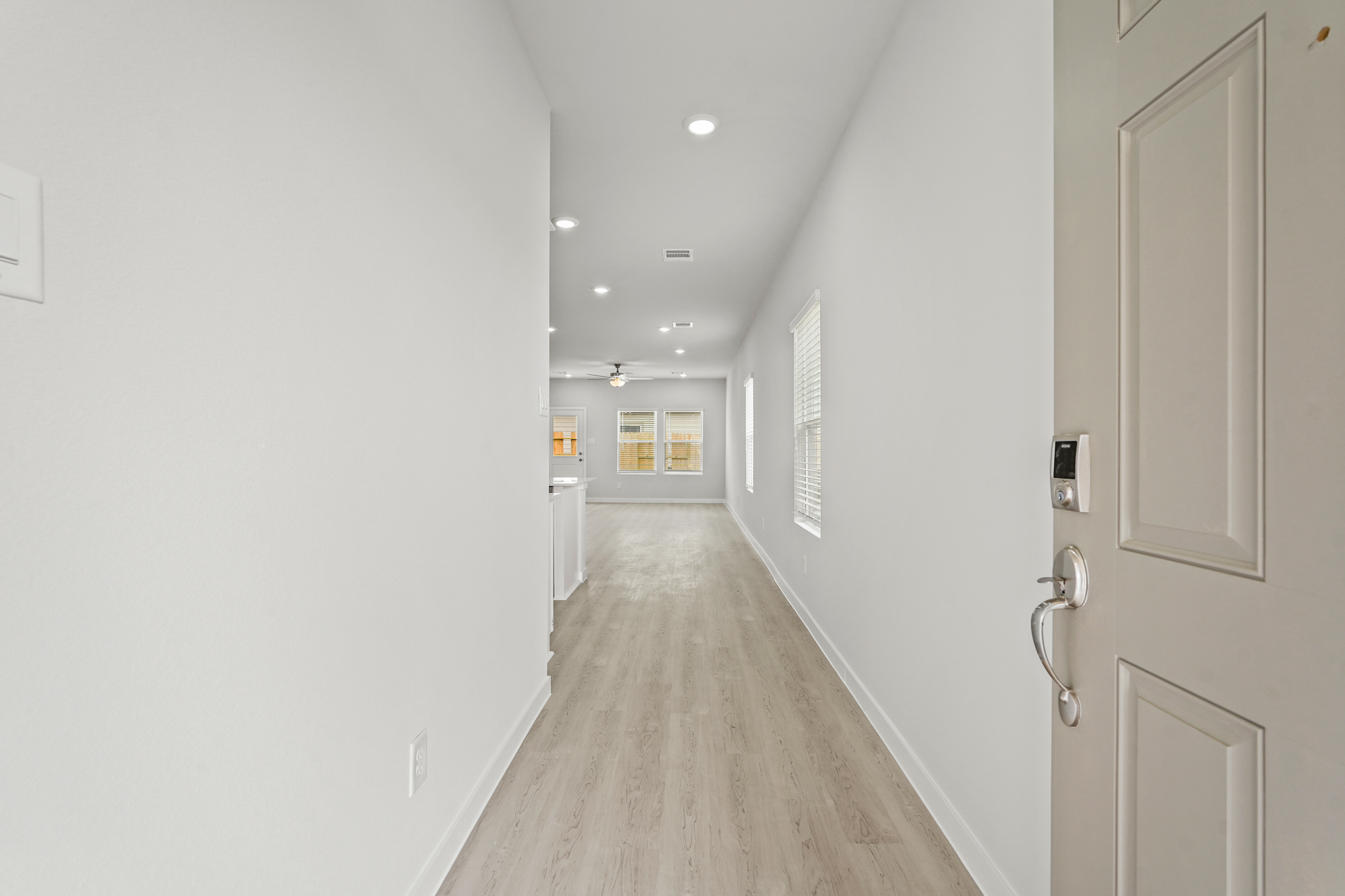 A hallway with white doors.