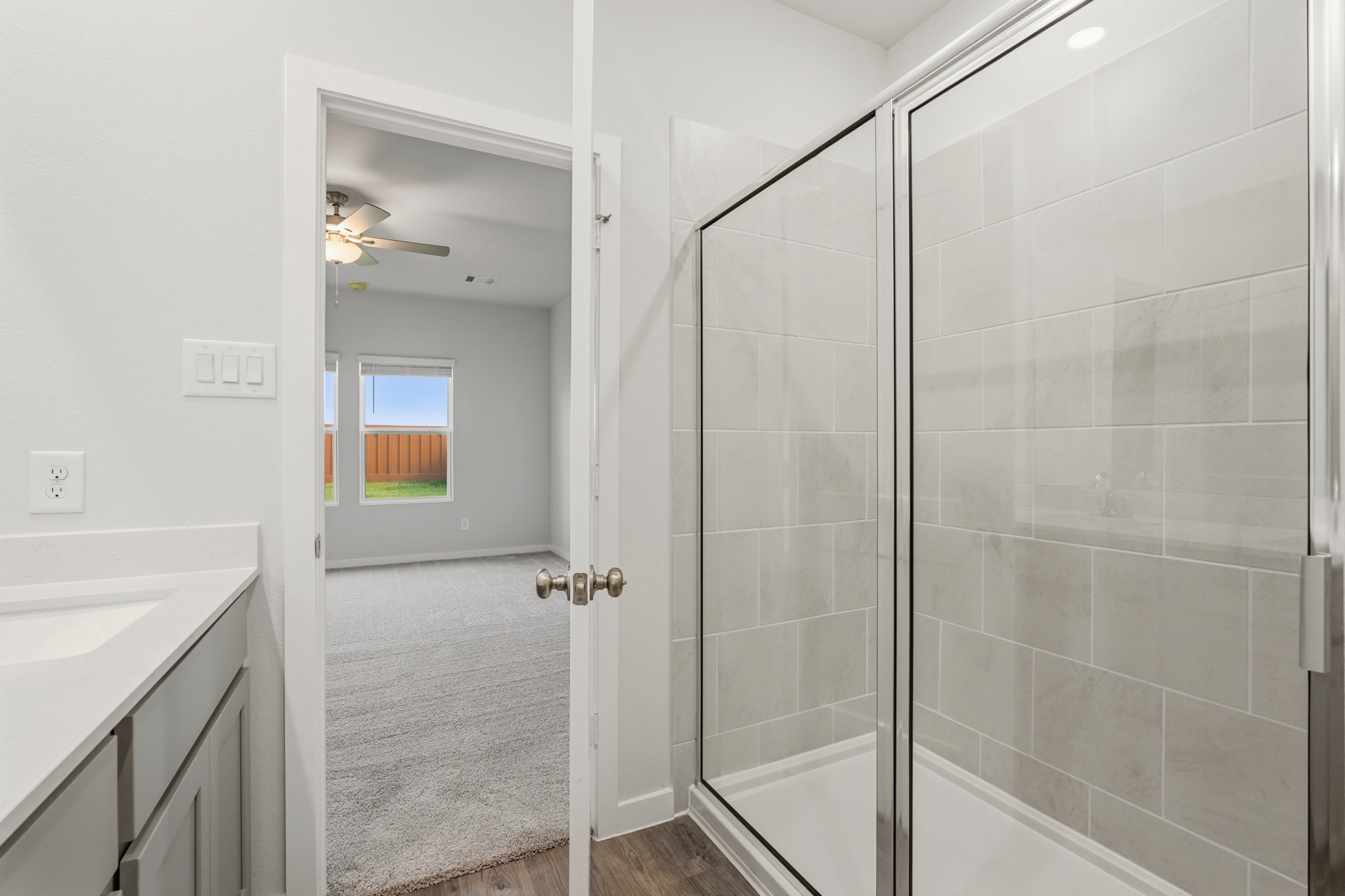 A bathroom with a glass shower.