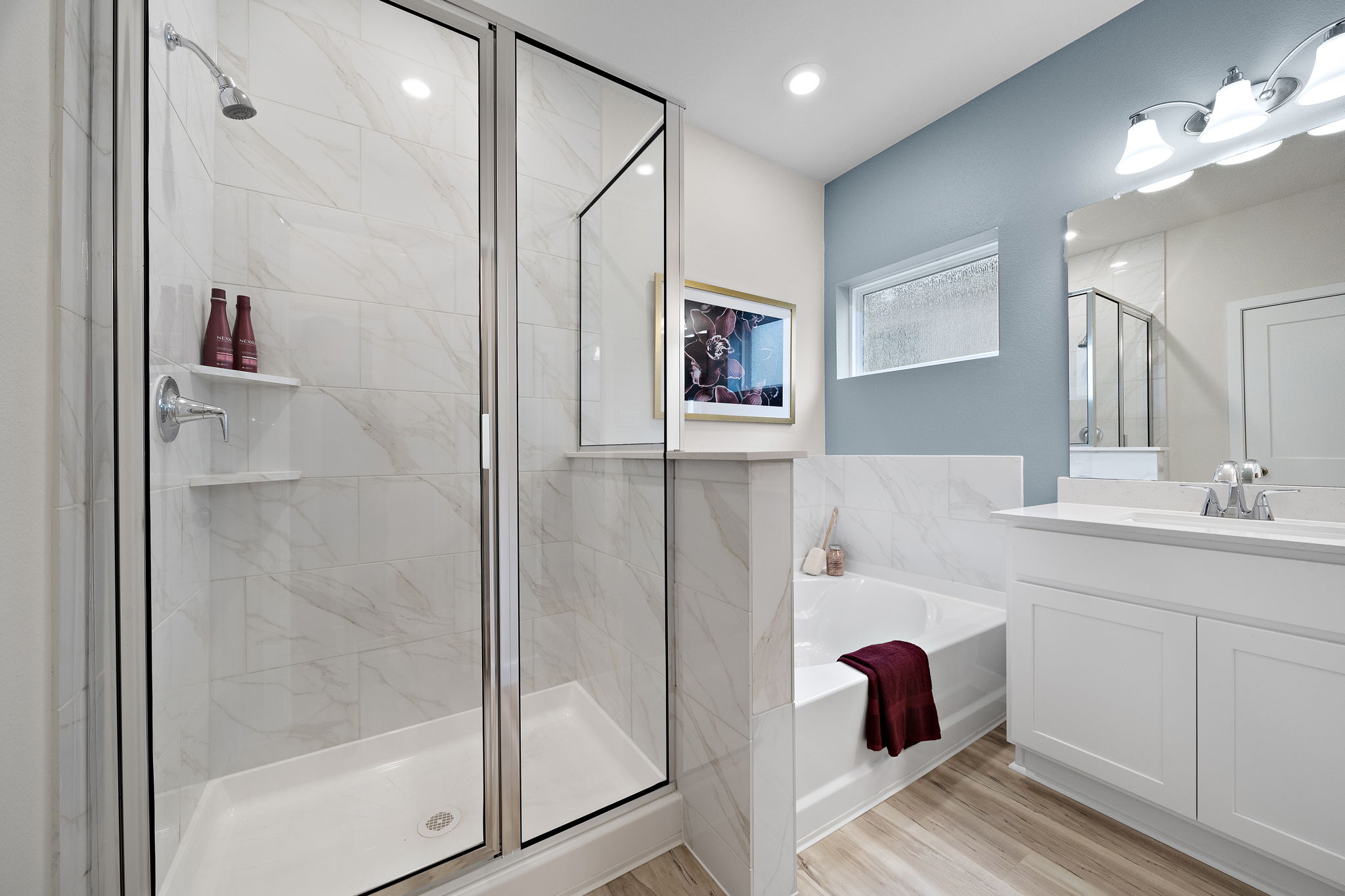 A bathroom with a glass shower.