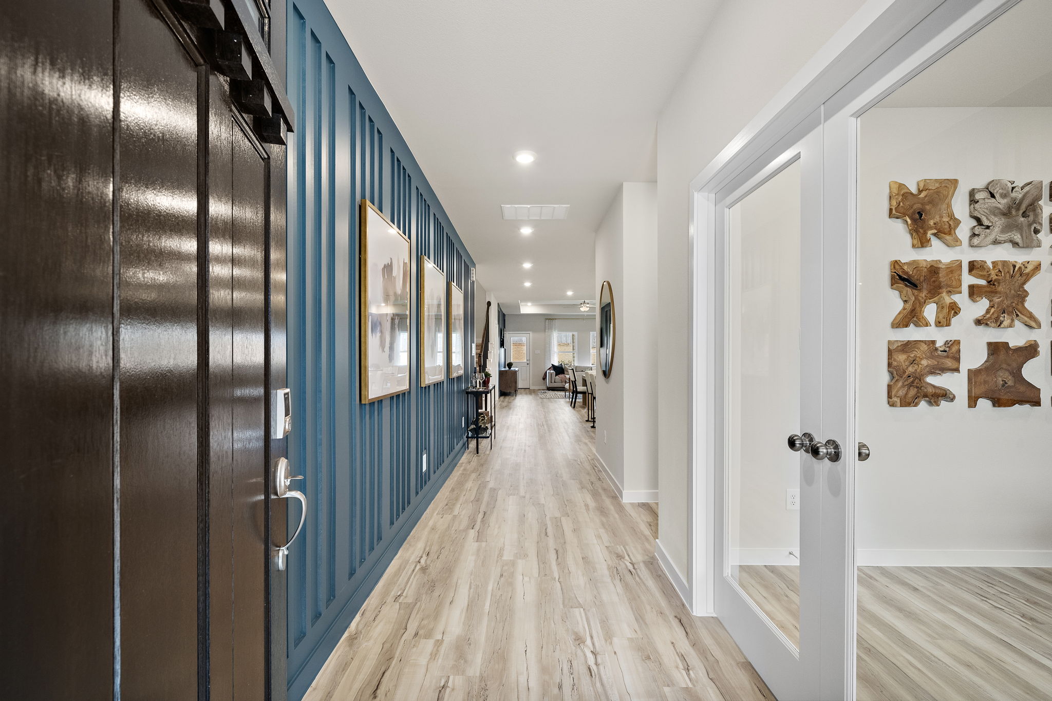 A hallway with blue doors.