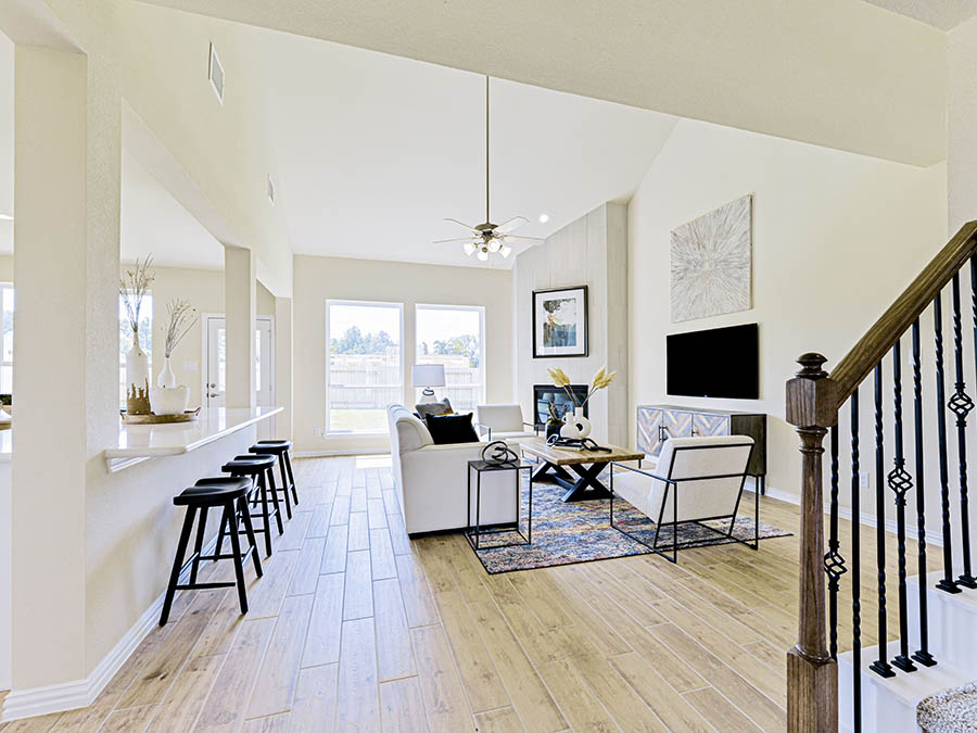 A living room with a wood floor.