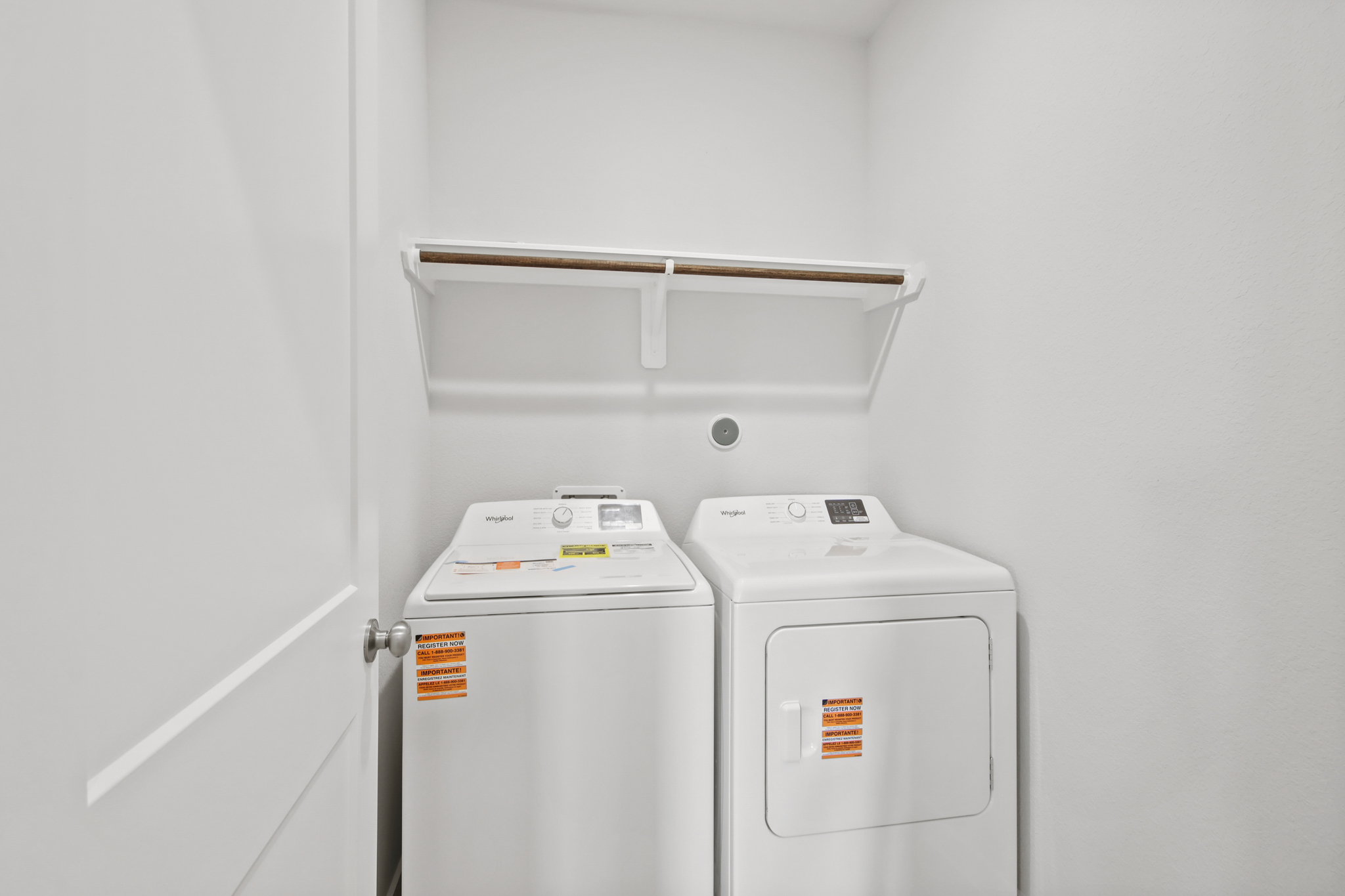 A white machine with a white door.