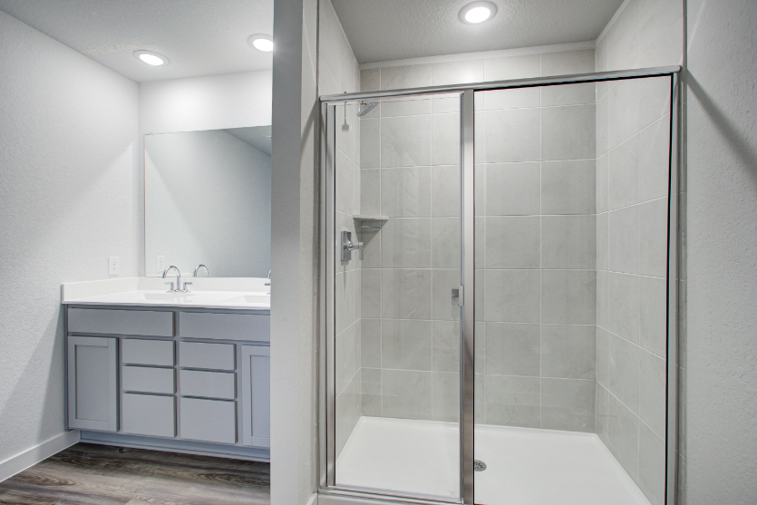A bathroom with a glass shower.