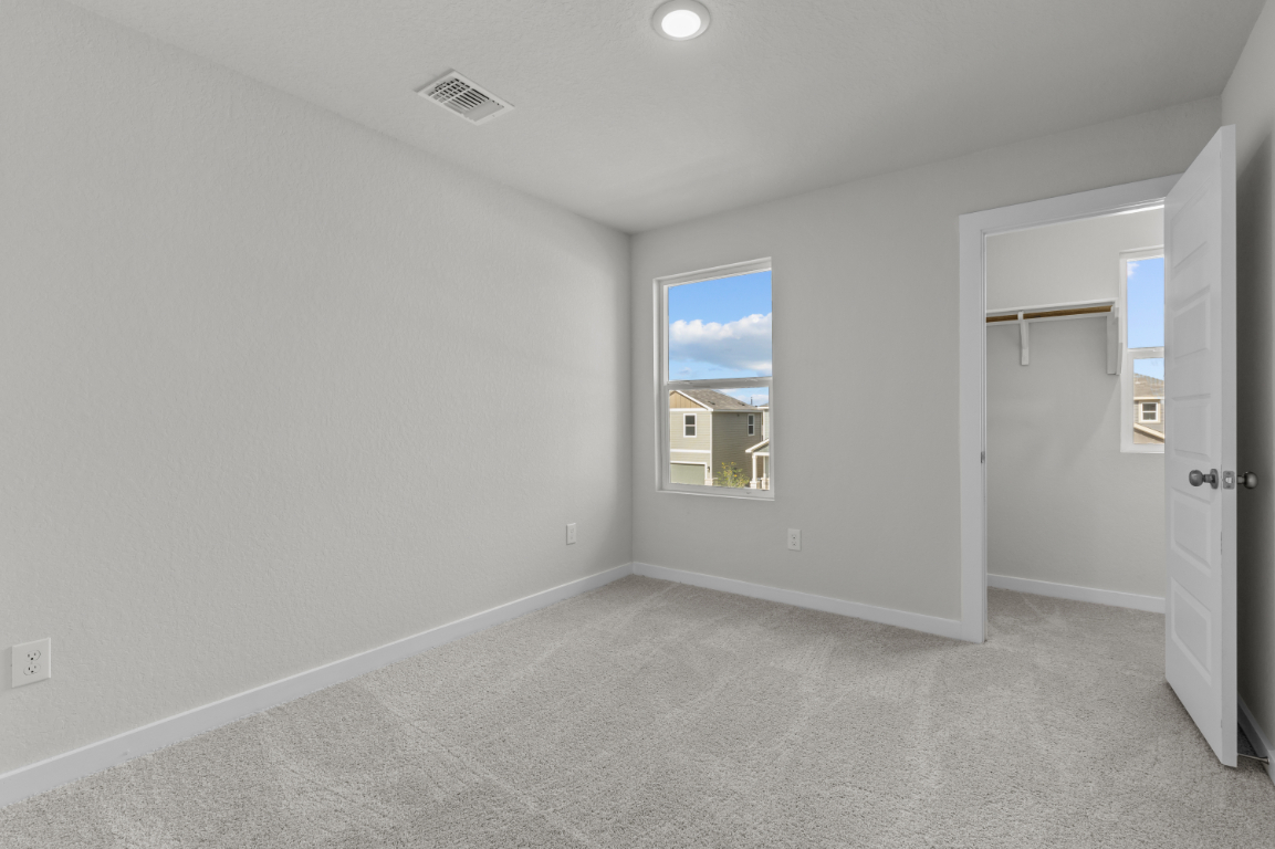 A room with a window and a door.