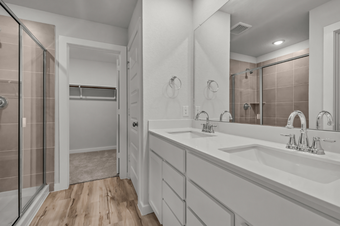 A bathroom with a glass shower.