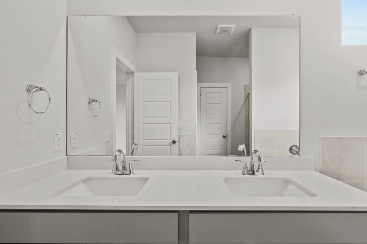 A bathroom with two sinks.
